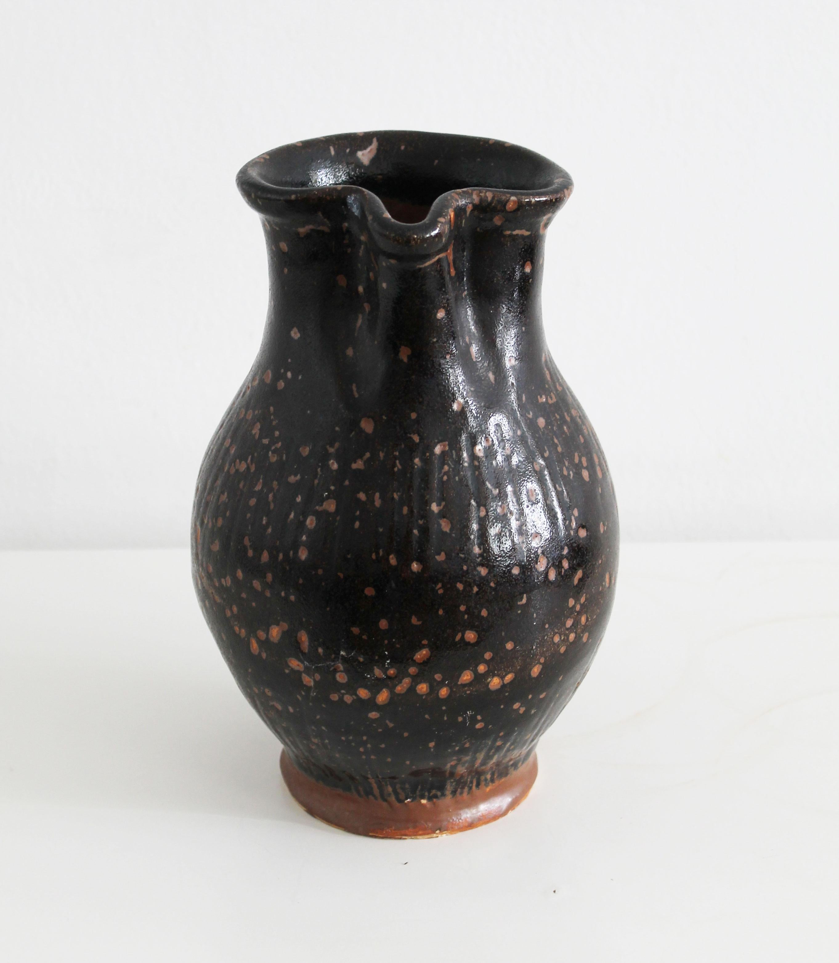 Austrian Antique pitcher made of dark glazed stoneware For Sale