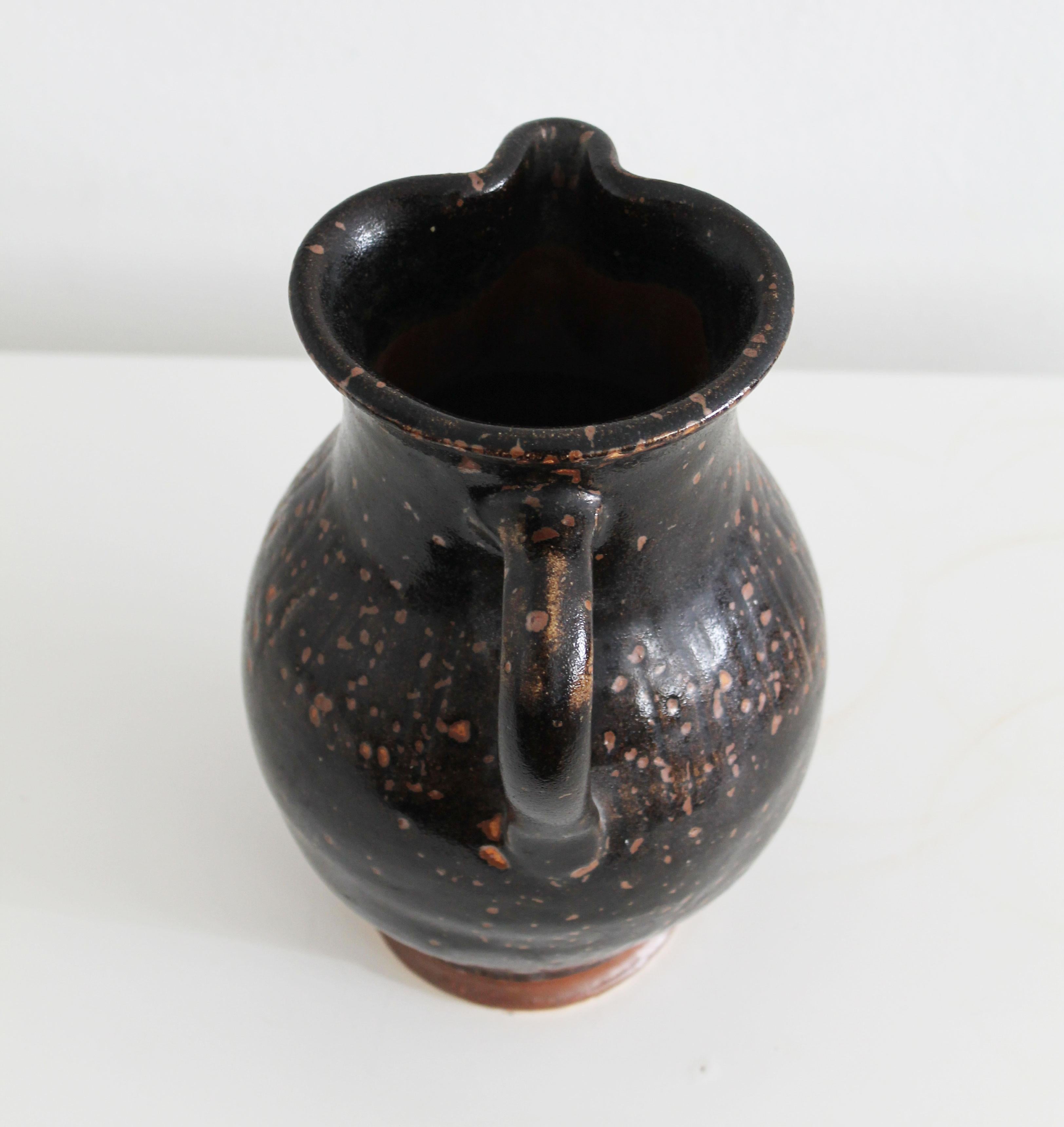 Stoneware Antique pitcher made of dark glazed stoneware For Sale