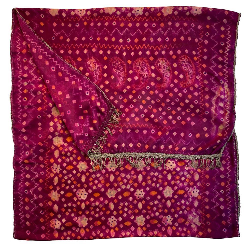 Antique Plangi and Tritik Silk Shawl, Palembang, Sumatra.
A rectangular silk textile with decoration by means of plangi (rainbow tie-dye) and tritik (stitched and gathered resist) processes in the primary colors of purple and orange  with green