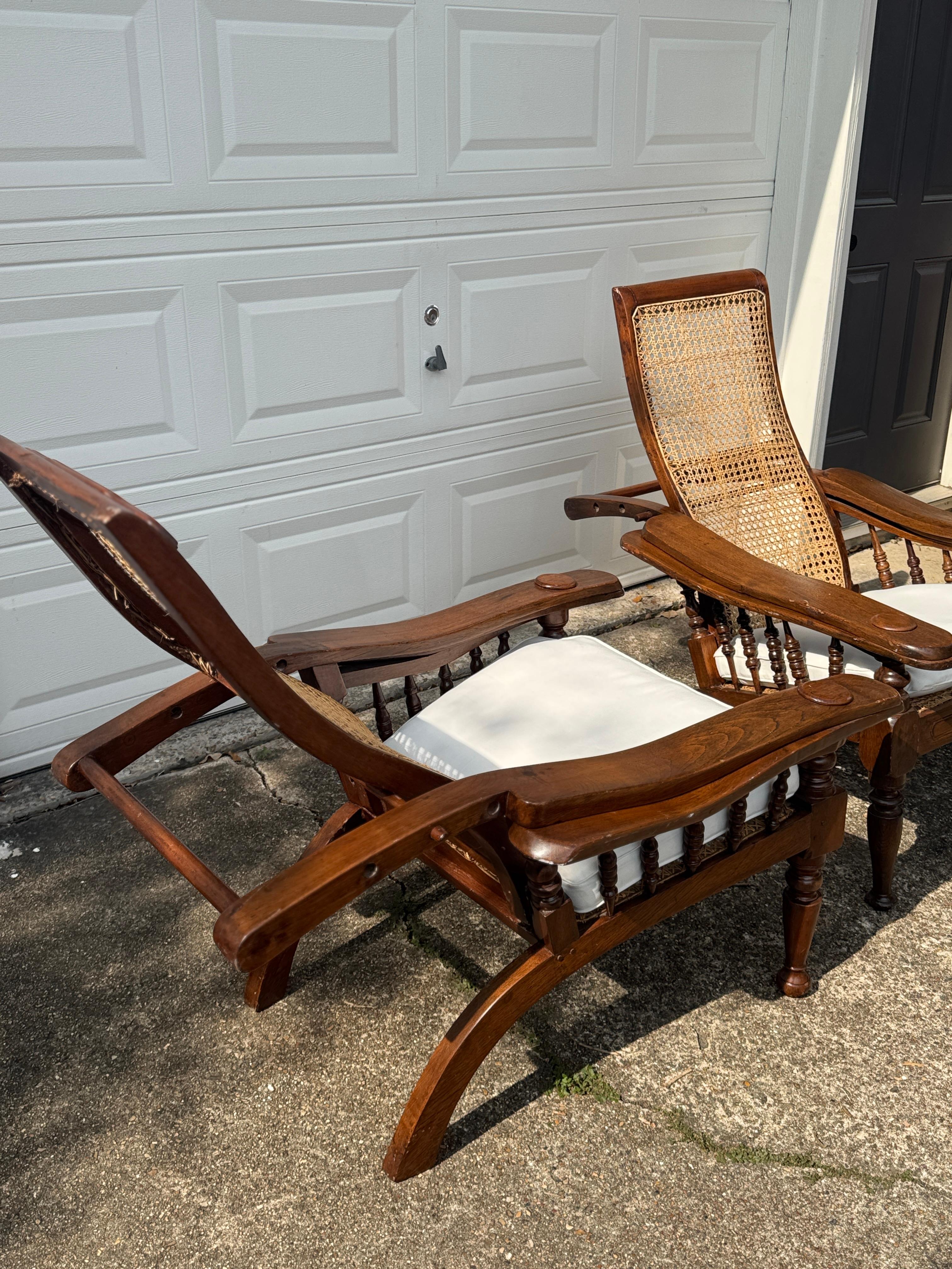 Antique plantation chair with handwoven cane and fold out footrests, circa 1920S For Sale 5
