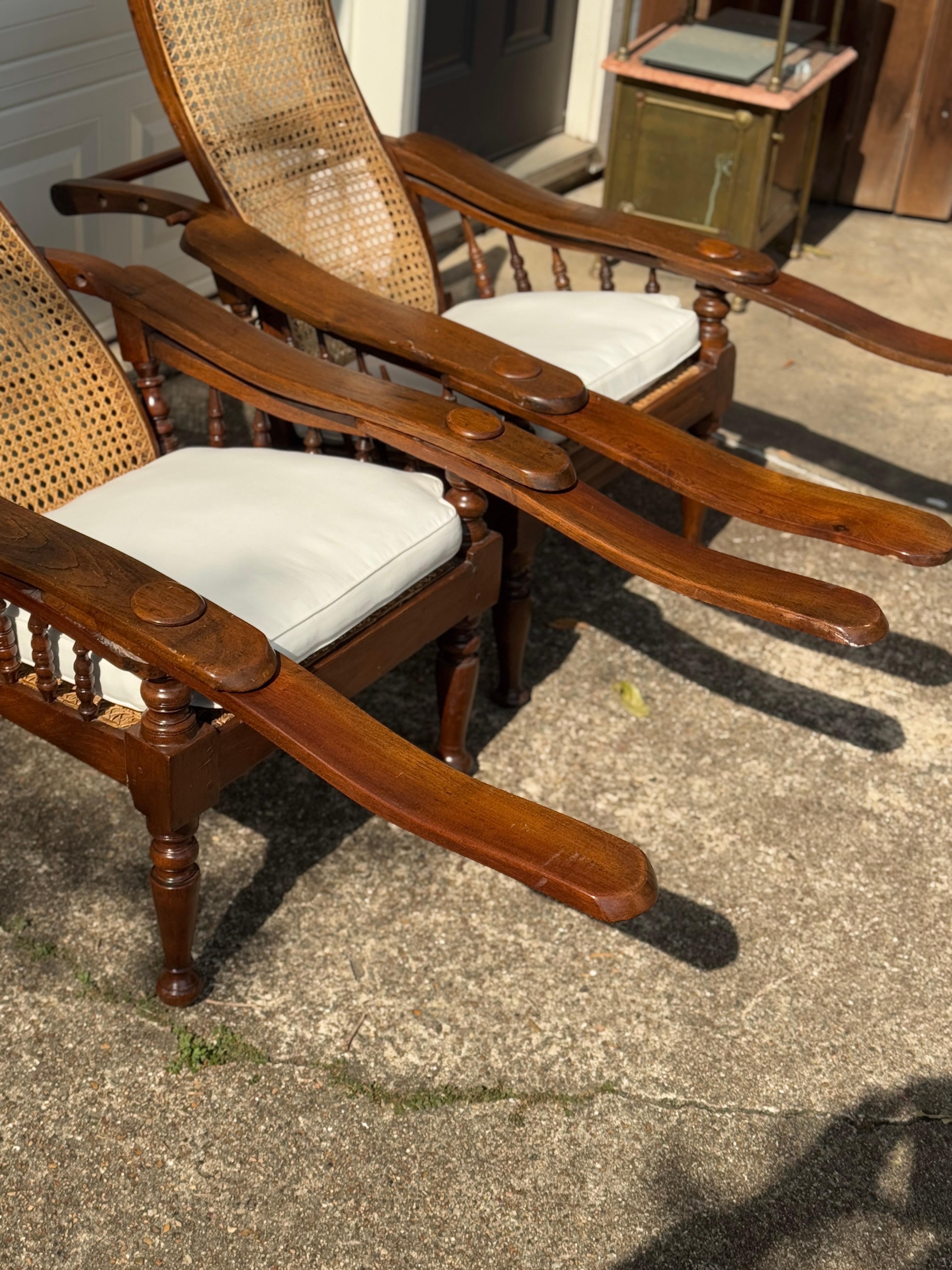 Antique plantation chair with handwoven cane and fold out footrests, circa 1920S For Sale 9