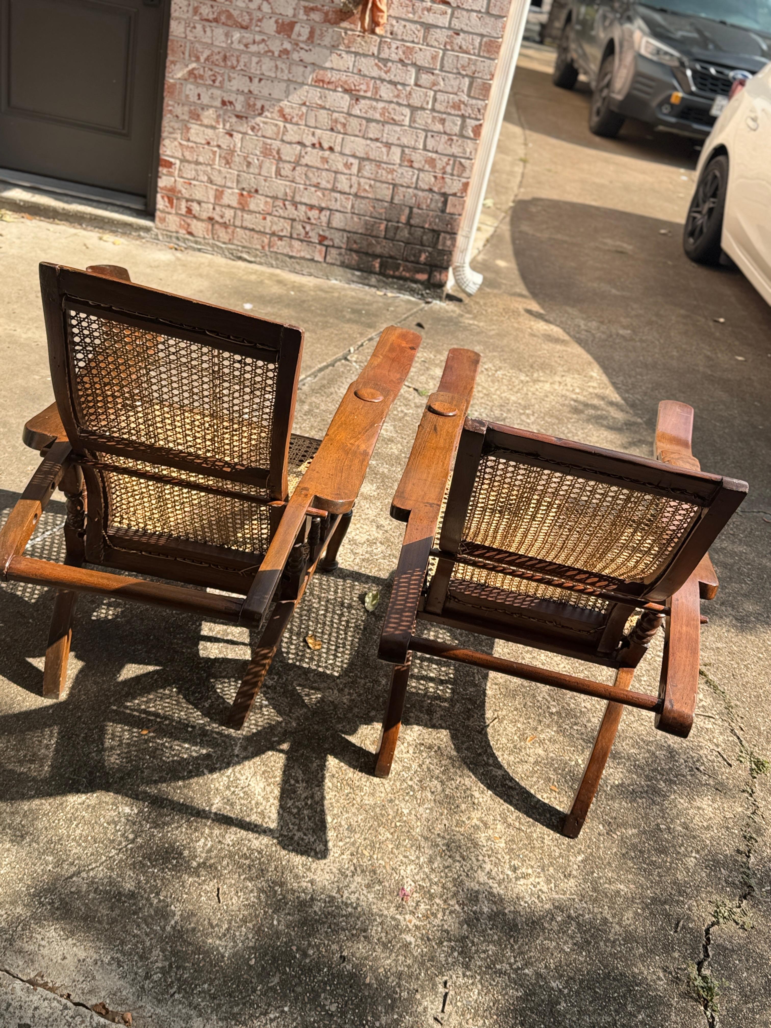 Antique plantation chair with handwoven cane and fold out footrests, circa 1920S For Sale 12