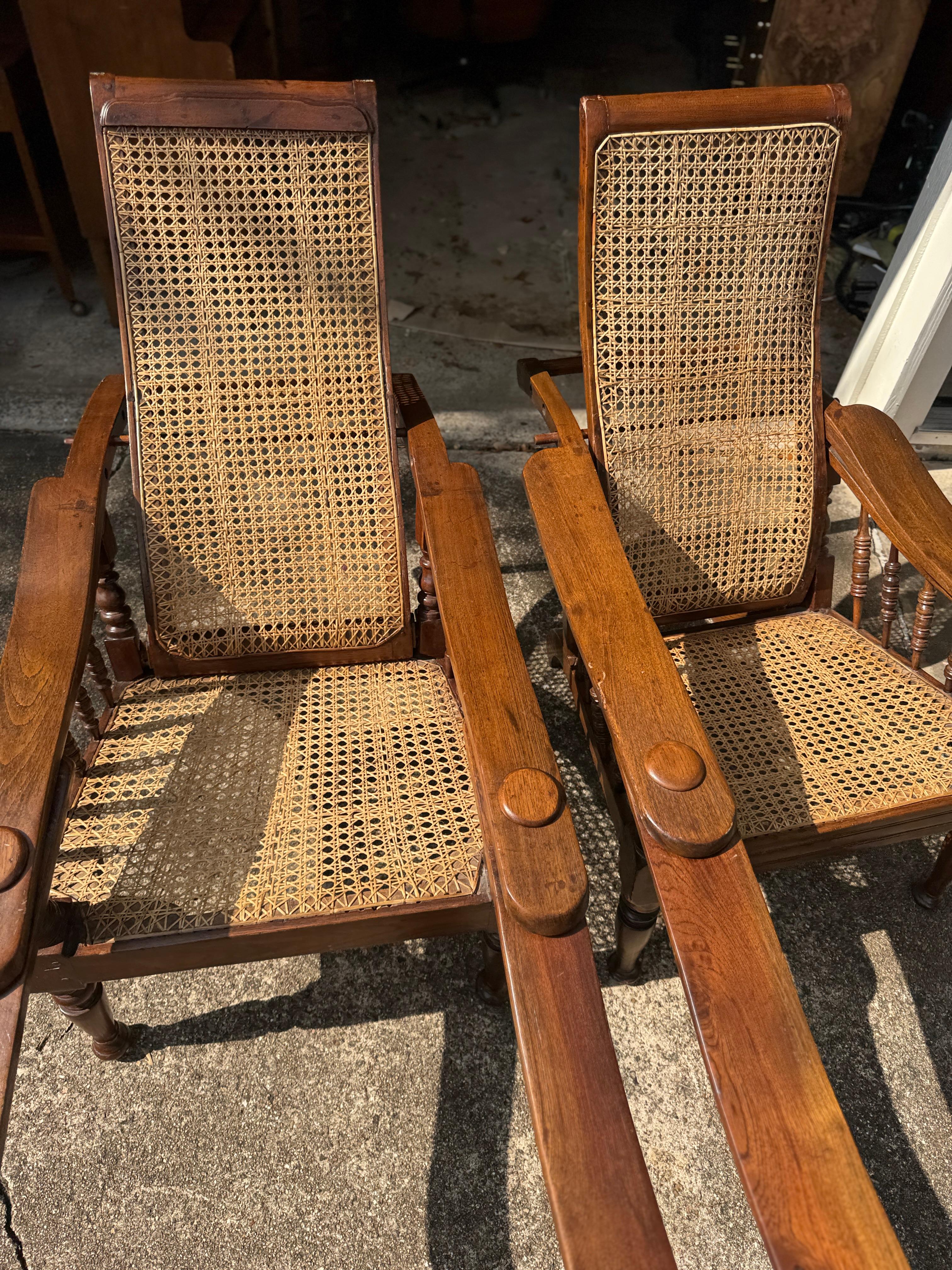 Antique plantation chair with handwoven cane and fold out footrests, circa 1920S For Sale 13