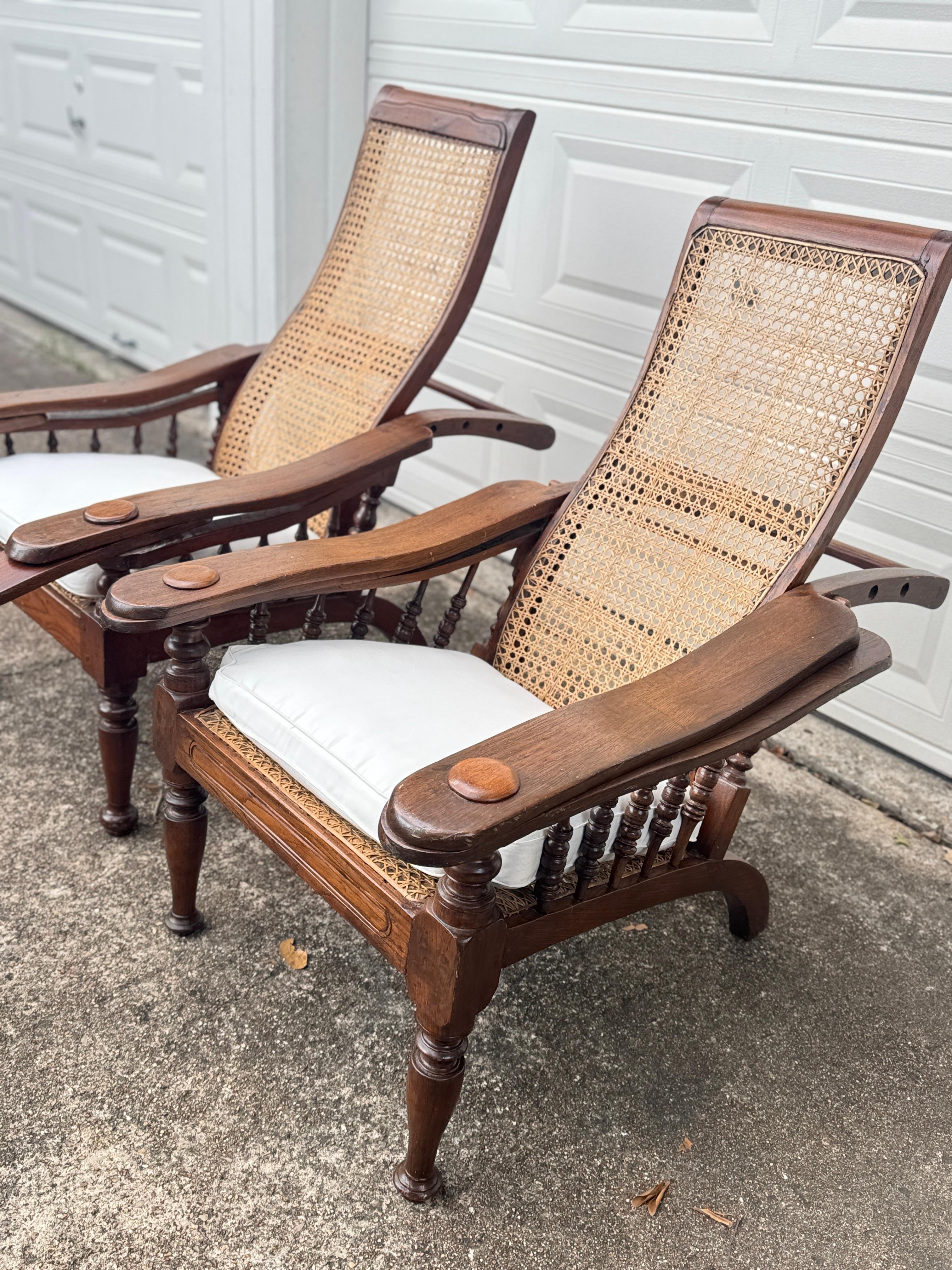 Antique plantation chair with handwoven cane and fold out footrests, circa 1920S For Sale 1