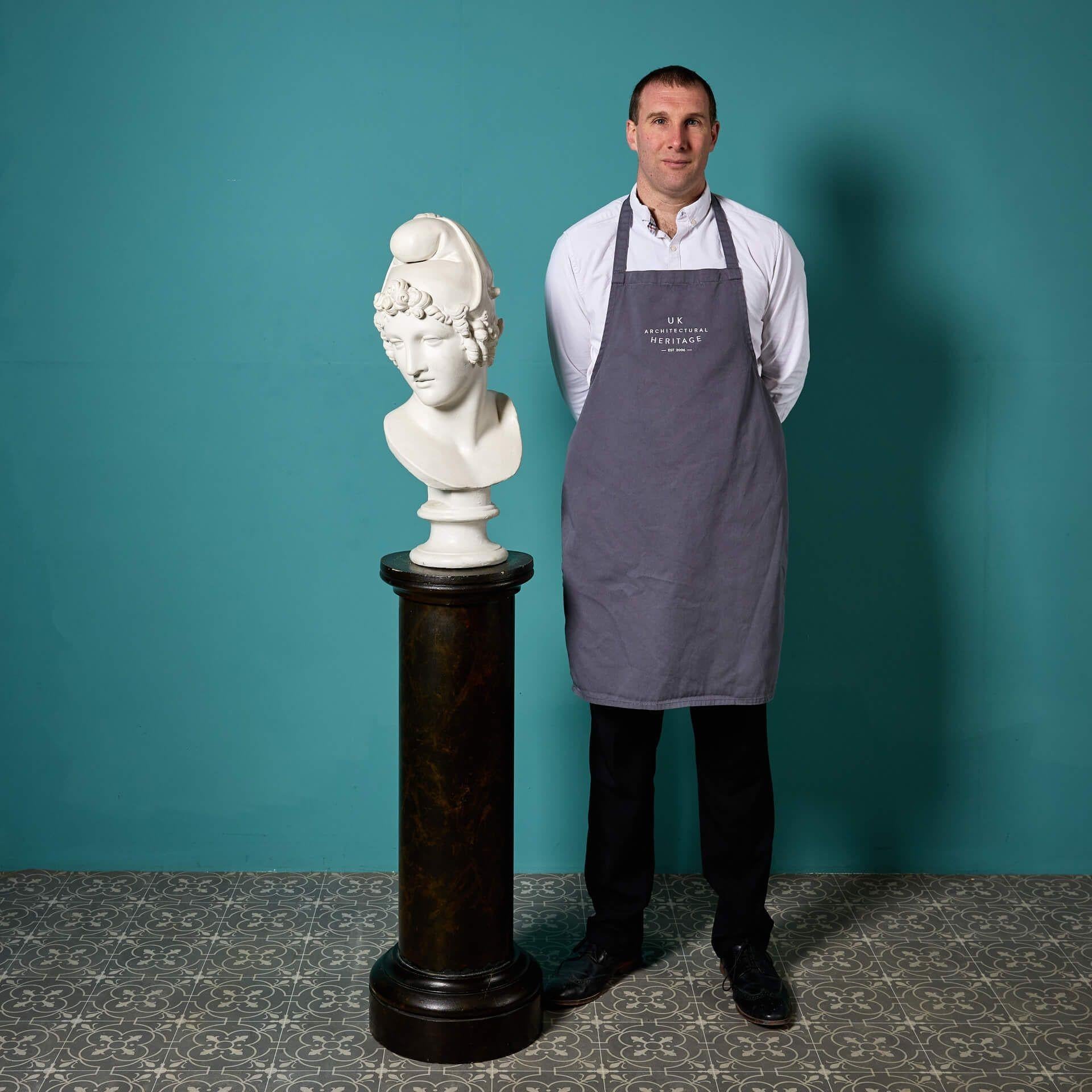 An antique plaster bust of Apollo in life-size form raised on a simulated marble column.

Dating from the late 19th century, this superb plaster figure will make a handsome feature of an indoor space, looking particularly striking in a hallway or