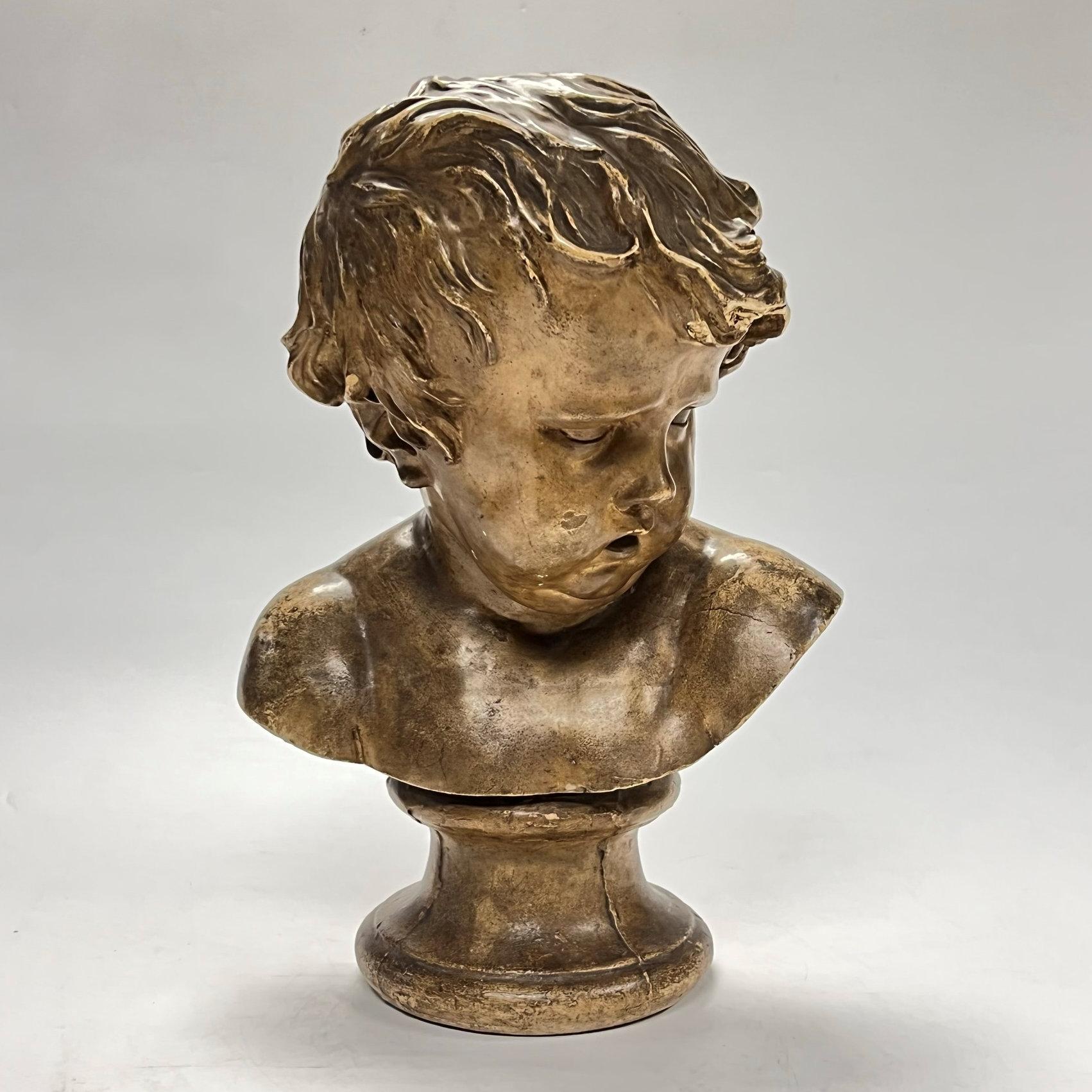 Antique Grand Tour plaster bust of a cherub after the original model by Francois Duquesnoy (1597-1643) dating from the early 20th century.  Likely of Italian or French origin.
