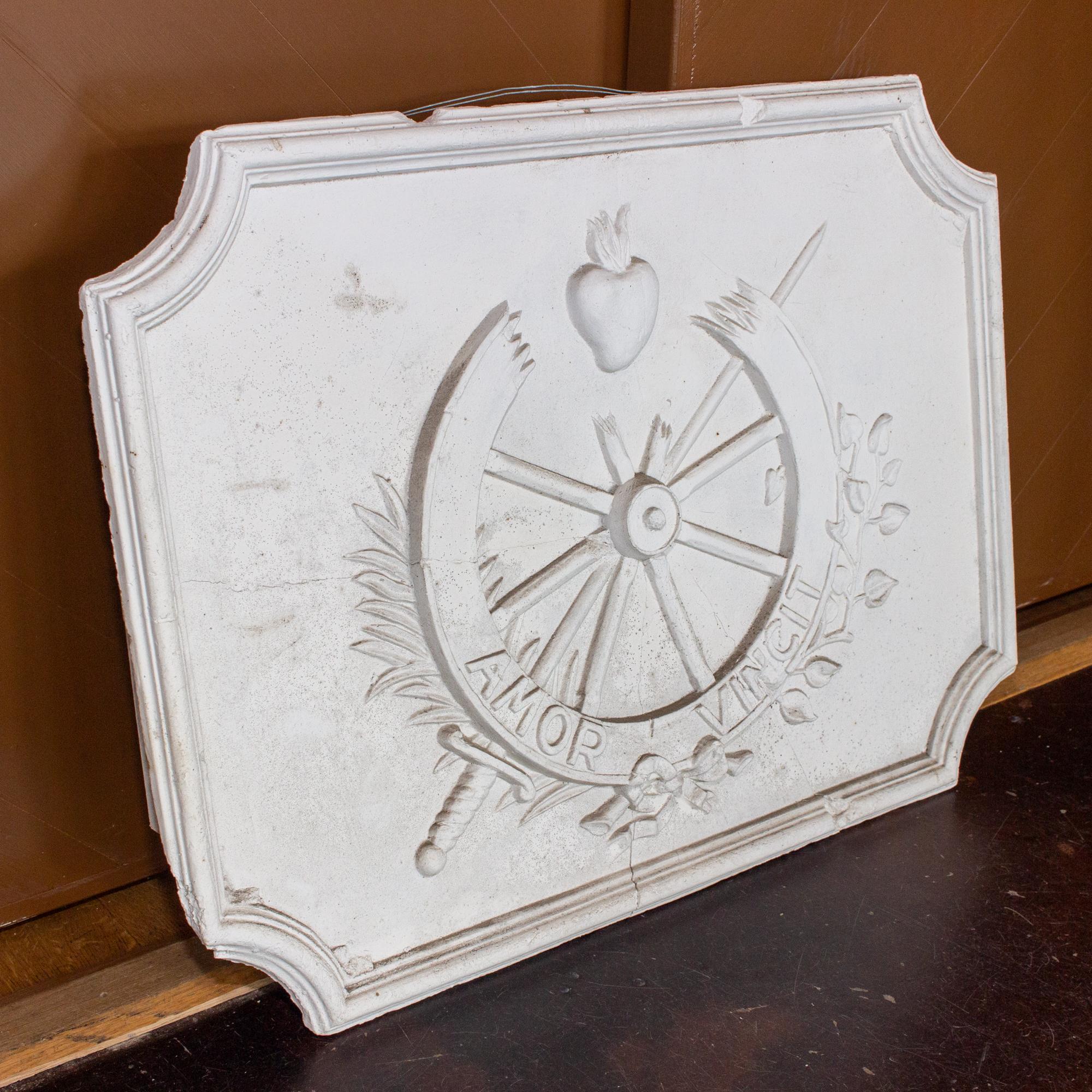 This decorative plaster wall panel features intriguing nautical imagery. First, the 