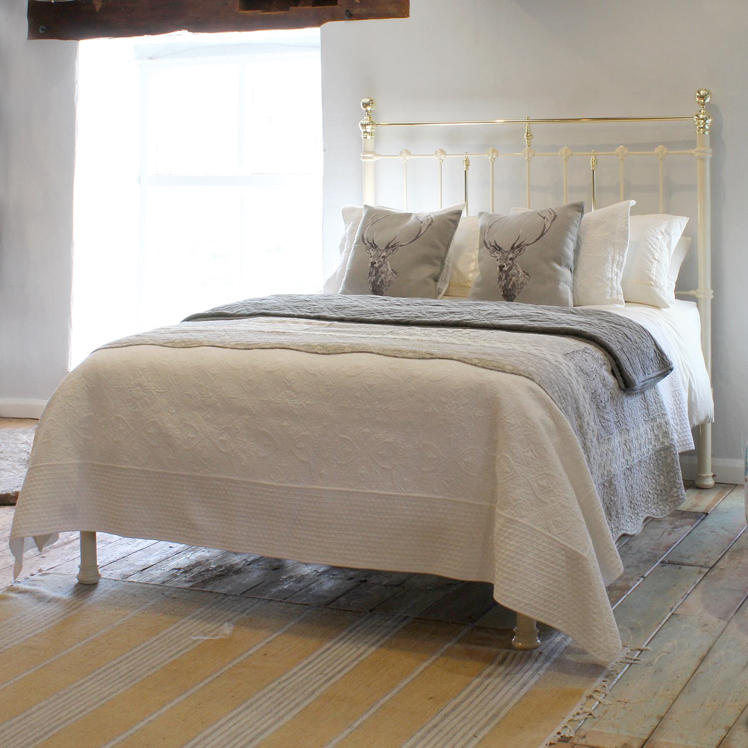 A fine example of an antique brass and iron bed finished in cream with straight brass top rail and low foot board.

This bed accepts a UK King or US Queen, 5ft or 60in wide, mattress and base.

The price also includes a firm bed base to support the