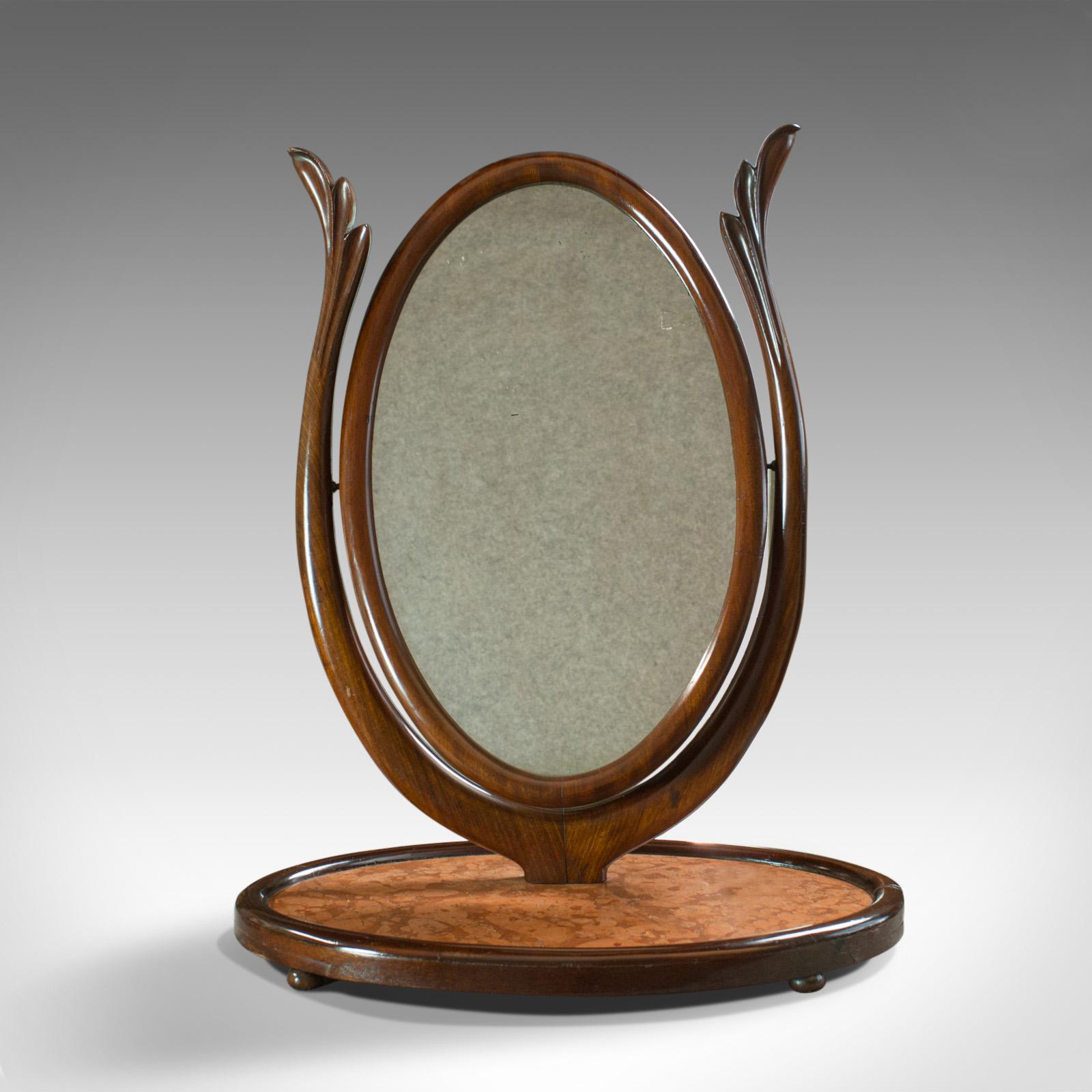 This is an antique platform mirror. An English, Regency, mahogany, vanity, toilet swing mirror dating to the mid-19th century, circa 1830.

Quality mahogany with rich colour and fine grain interest
Standing upon an inset marble platform, well