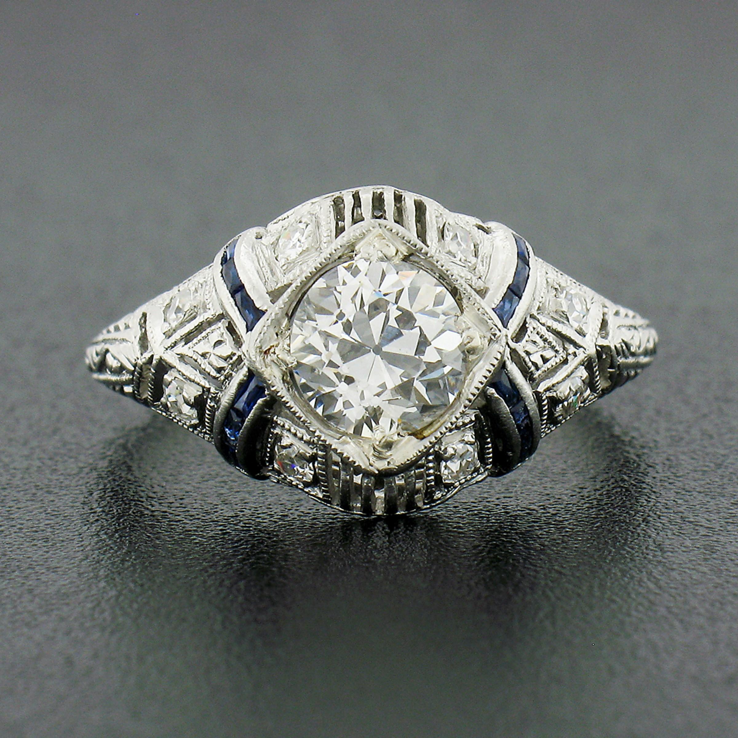 Here we have an absolutely gorgeous antique ring that was crafted from solid platinum during the art deco period. This ring features a, GIA certified, old European cut diamond neatly set at the center of the puffed top and shows a large attractive