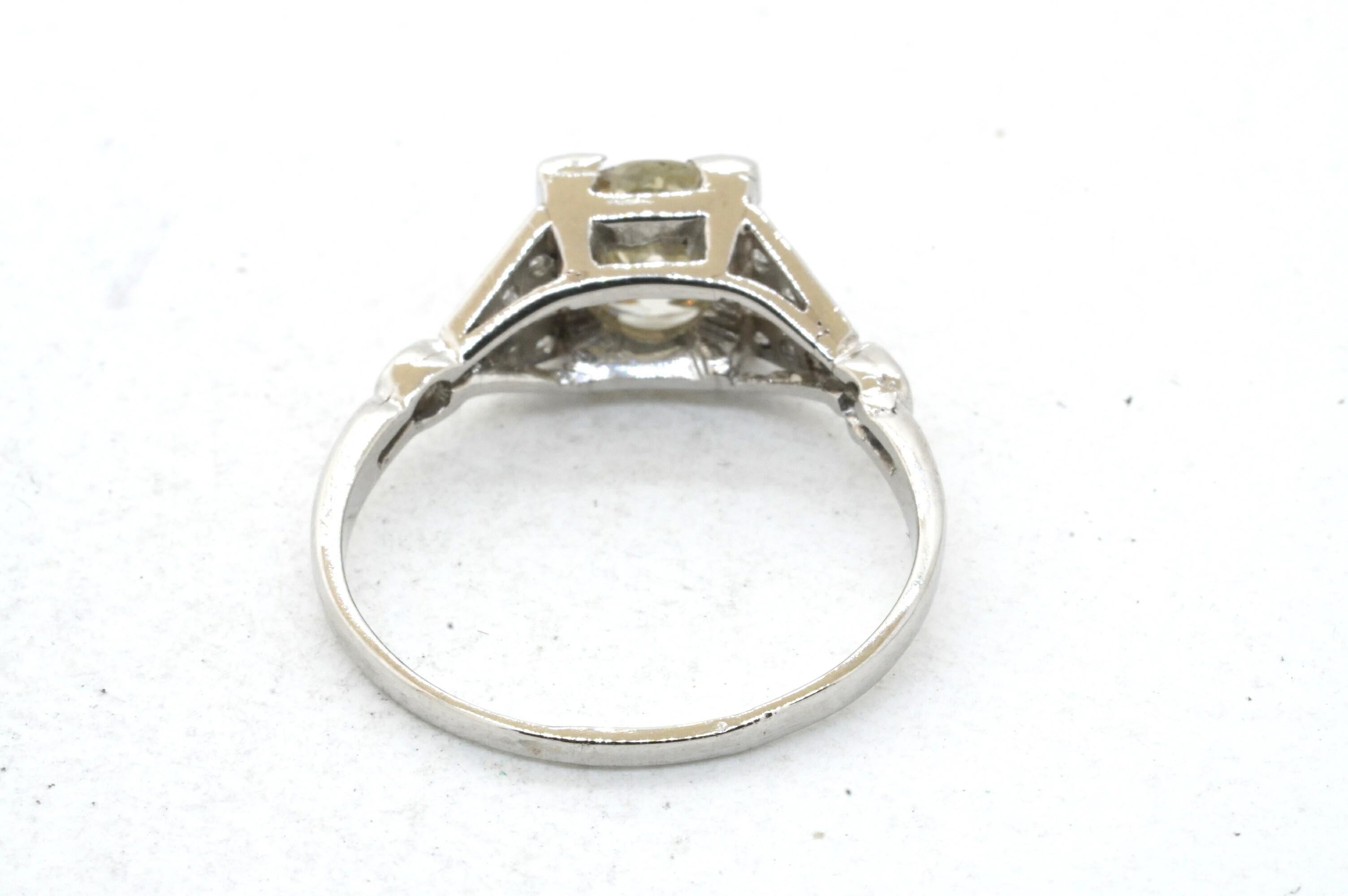 Antique Platinum 1.10CT diamond cocktail ring w/ 0.93CT center sz. 5.5. This outstanding piece of jewelry is crafted in gorgeous Platinum and features 13 diamonds with a combined weight of approx. 1.05CT. This includes an approx. 0.93CT Round cut