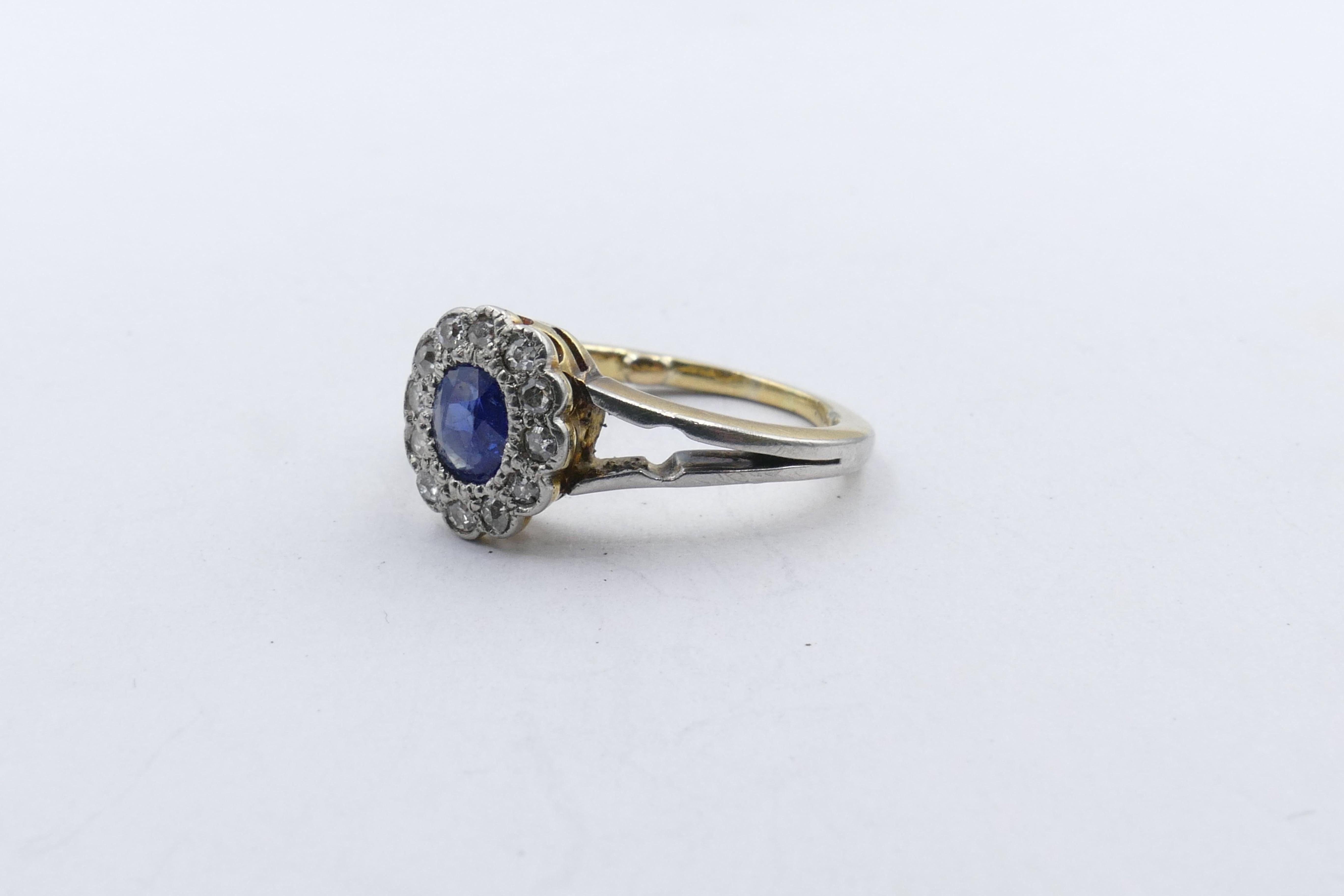 This pretty, probably Edwardian, Ring features a central oval cut Sapphire of 0.40 carats in medium blue colour. It is surrounded by 12 round brilliant cut Diamonds, G/H colour & SI clarity.
A small finger size of H & half but can easily be