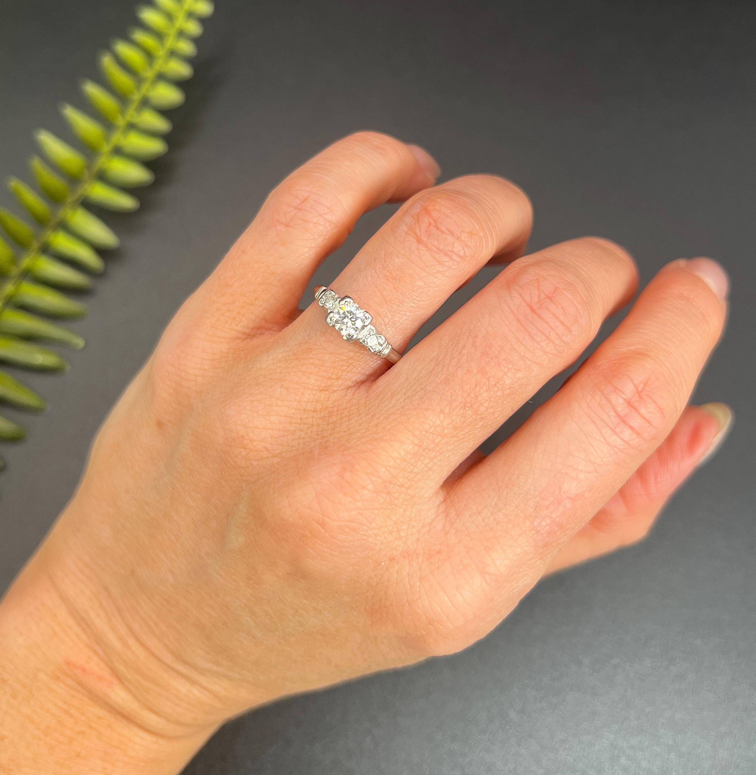 Antique Diamond Ring

Platinum

Circa 1920s

Step back in time with this stunning engagement ring from the 1920s, crafted from luxurious platinum. This unique piece features a mesmerising single diamond centrepiece, set in a square design and