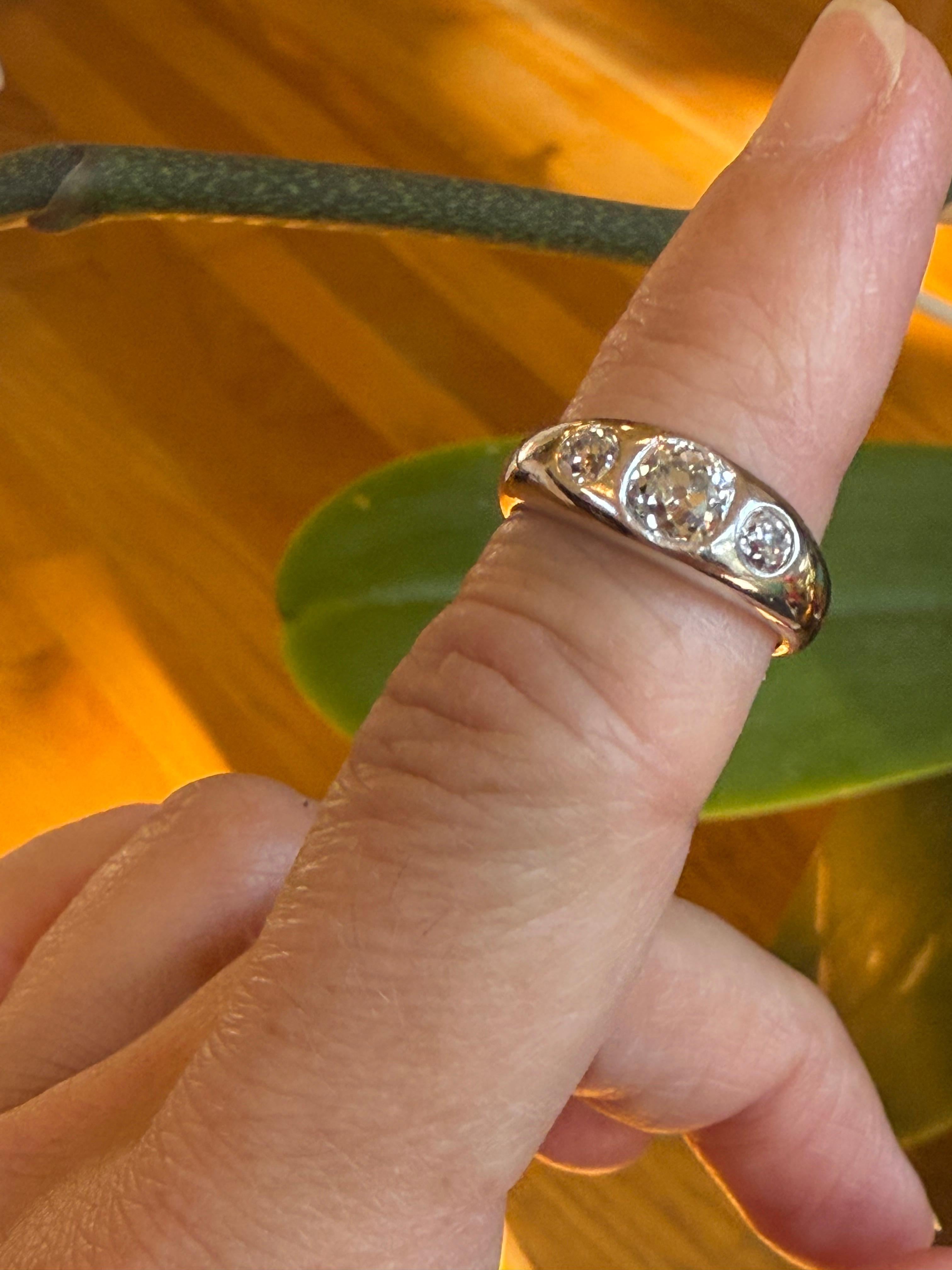 This is a really nice piece, and a classic interpretation of the gypsy ring style. Most of these rings were made in yellow gold, so to have a ring of this style made in Platinum, is quite special.

The ring has 3 old mine cut diamonds; the diamonds