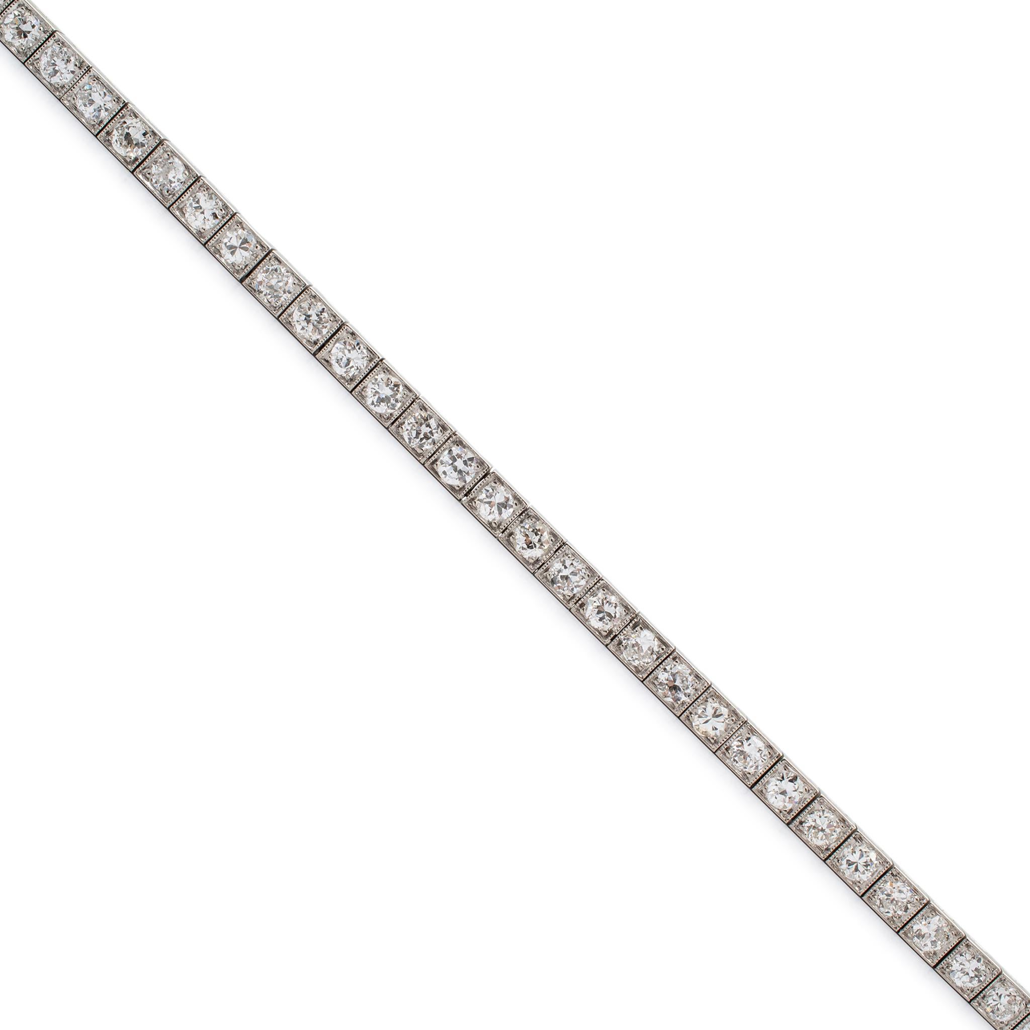 Gender: Ladies

Metal Type: 900 Platinum

Length: 7.00 inches

Width: 3.30 mm

Weight: 15.26 grams

One ladies custom made filigreed 900 platinum, diamond tennis bracelet. The metal was tested and determined to be 900 platinum.

Antique unpolished