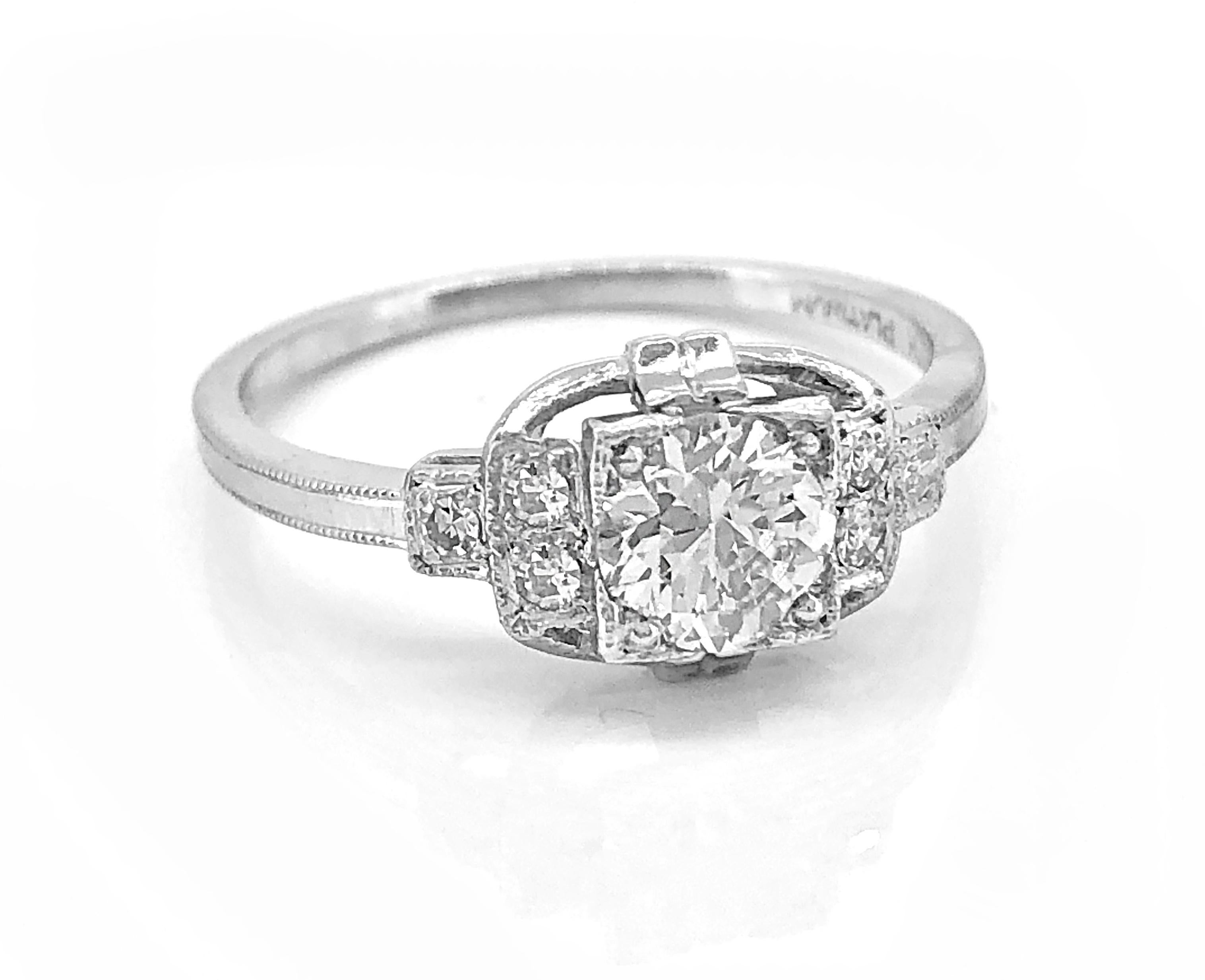 A step-down designed Art Deco diamond Antique engagement ring features a .55ct. apx. transitional cut diamond with VS2 clarity and G color. The single cut diamond melee weighs .06ct. apx. T.W. and has VS1-VS2 clarity and G-H color. This ring is