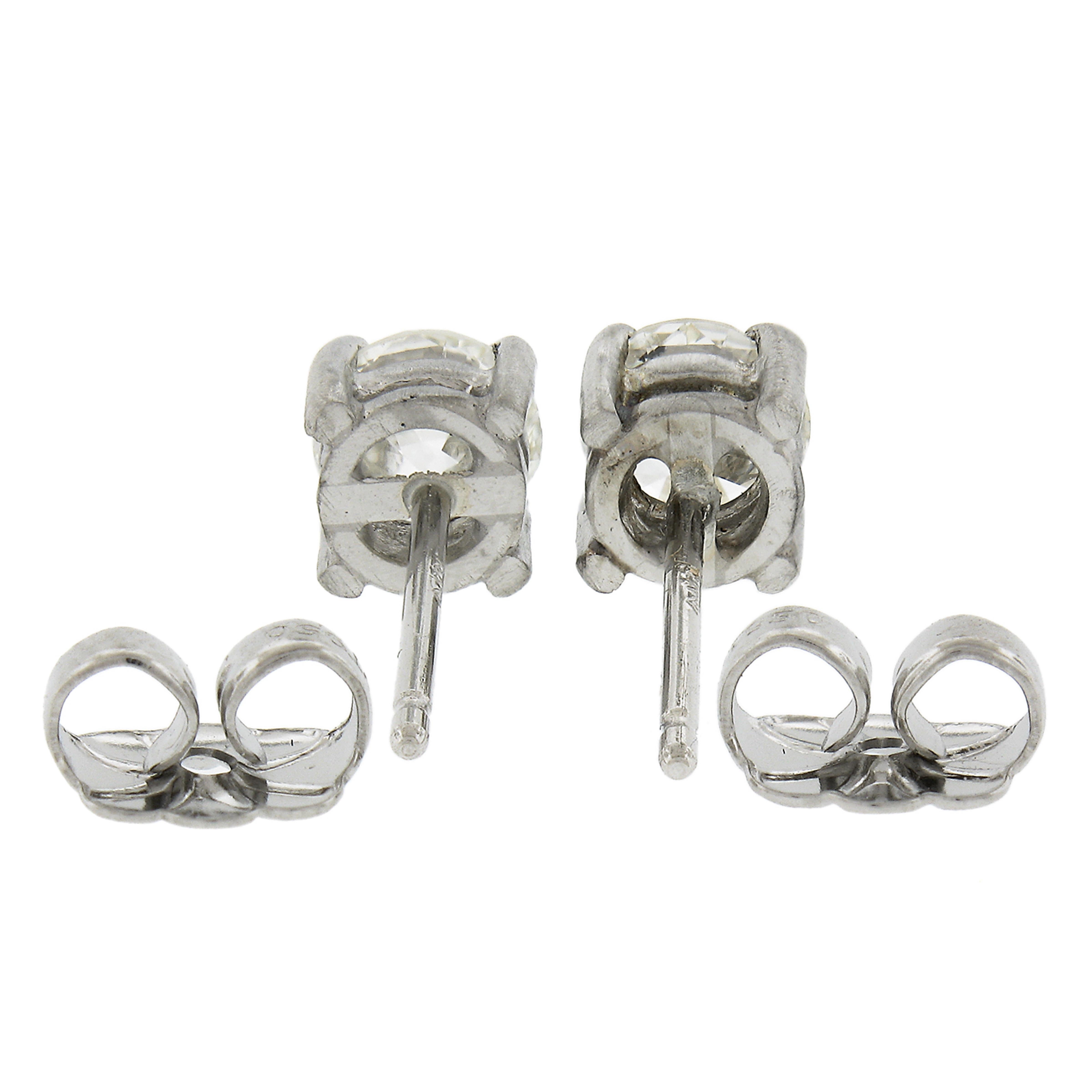 --Stone(s):--
(2) Natural Genuine Diamonds - Old European Cut - 4-Prong Set - I/J Color -SI1/SI2 Clarity
Total Carat Weight:	0.88 (exact)

Material: Solid Platinum 
Weight: 1.87 Grams
Backing:	Post Backs w/ Sturdy Butterfly Closures (Pierced ears