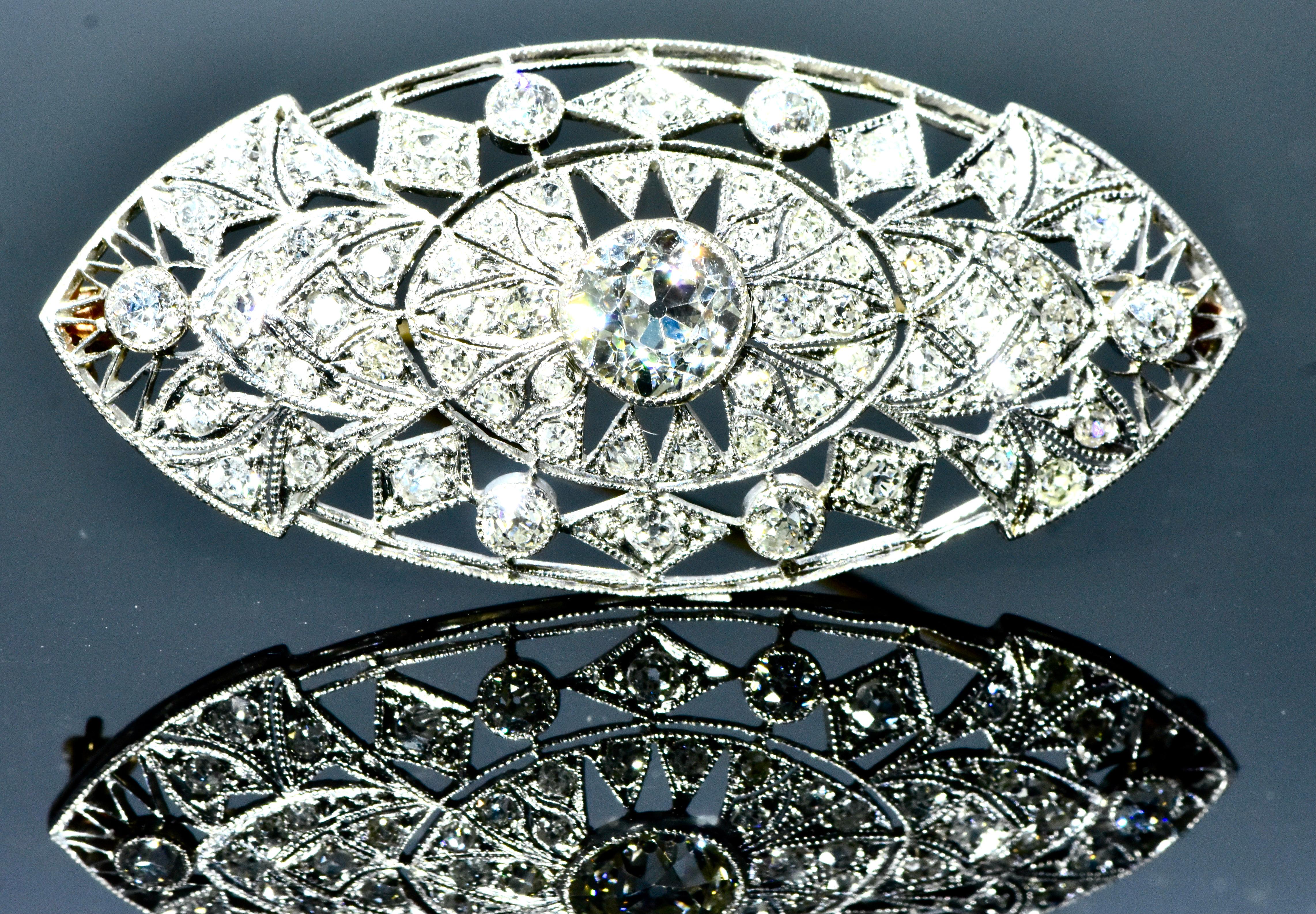 Antique platinum and diamond brooch.  This well made platinum pin possesses 62 well cut and well matched diamonds amounting to approximately 2.76 cts.  All of the diamonds are estimated to be near colorless (H) and VS (very slightly included).  The