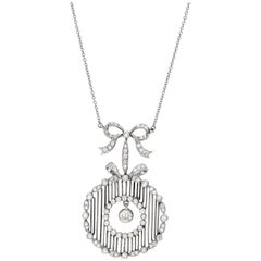 Antique Platinum and Diamond Bow Pendant circa 1910 1.50 Carat of Total Diamonds