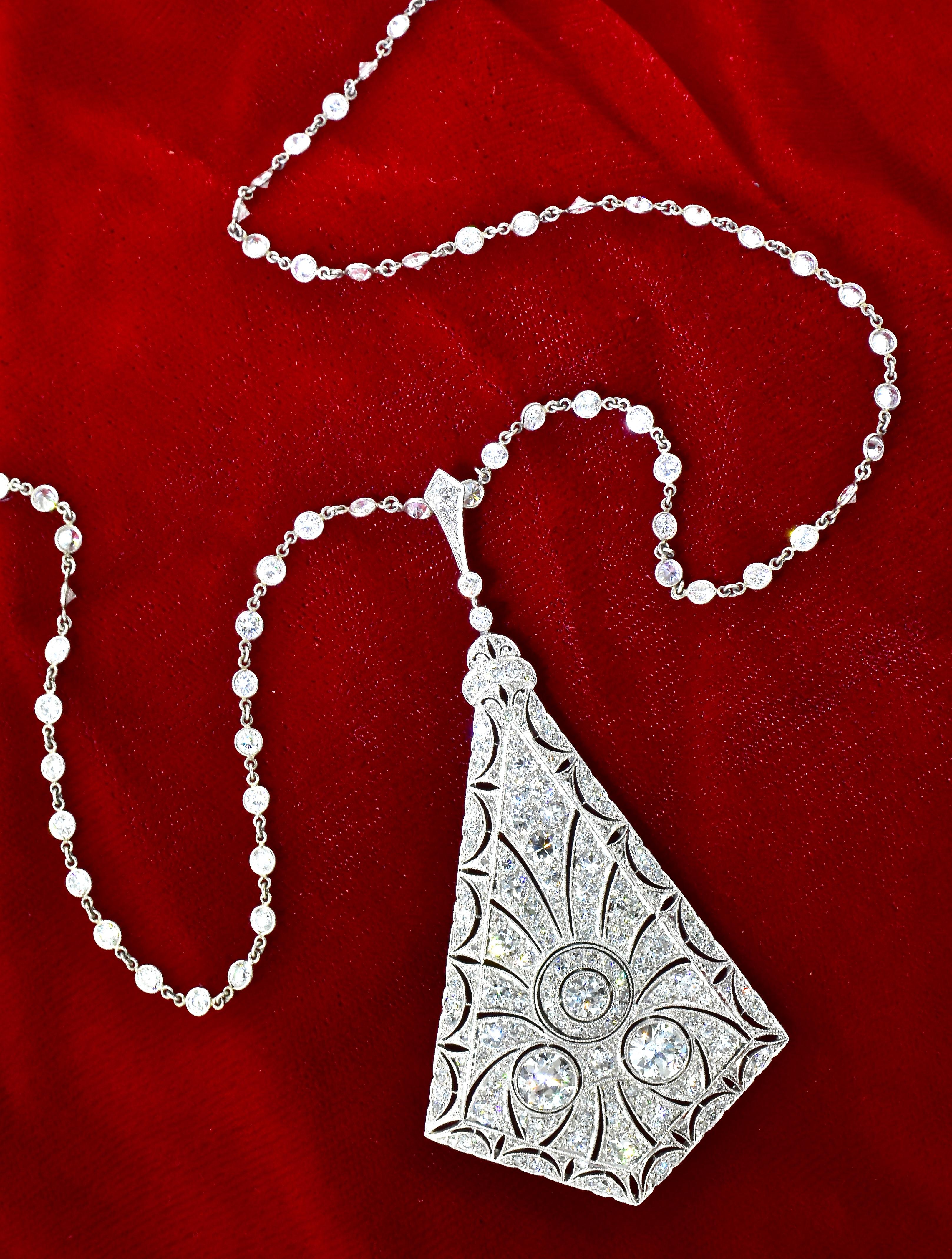 Antique diamond pendant necklace from the early Edwardian era.  159 finely matched old European cut diamonds are set in platinum.  These white diamonds are estimated to be near colorless (H/I) and very slightly included (VS) and weigh a total of