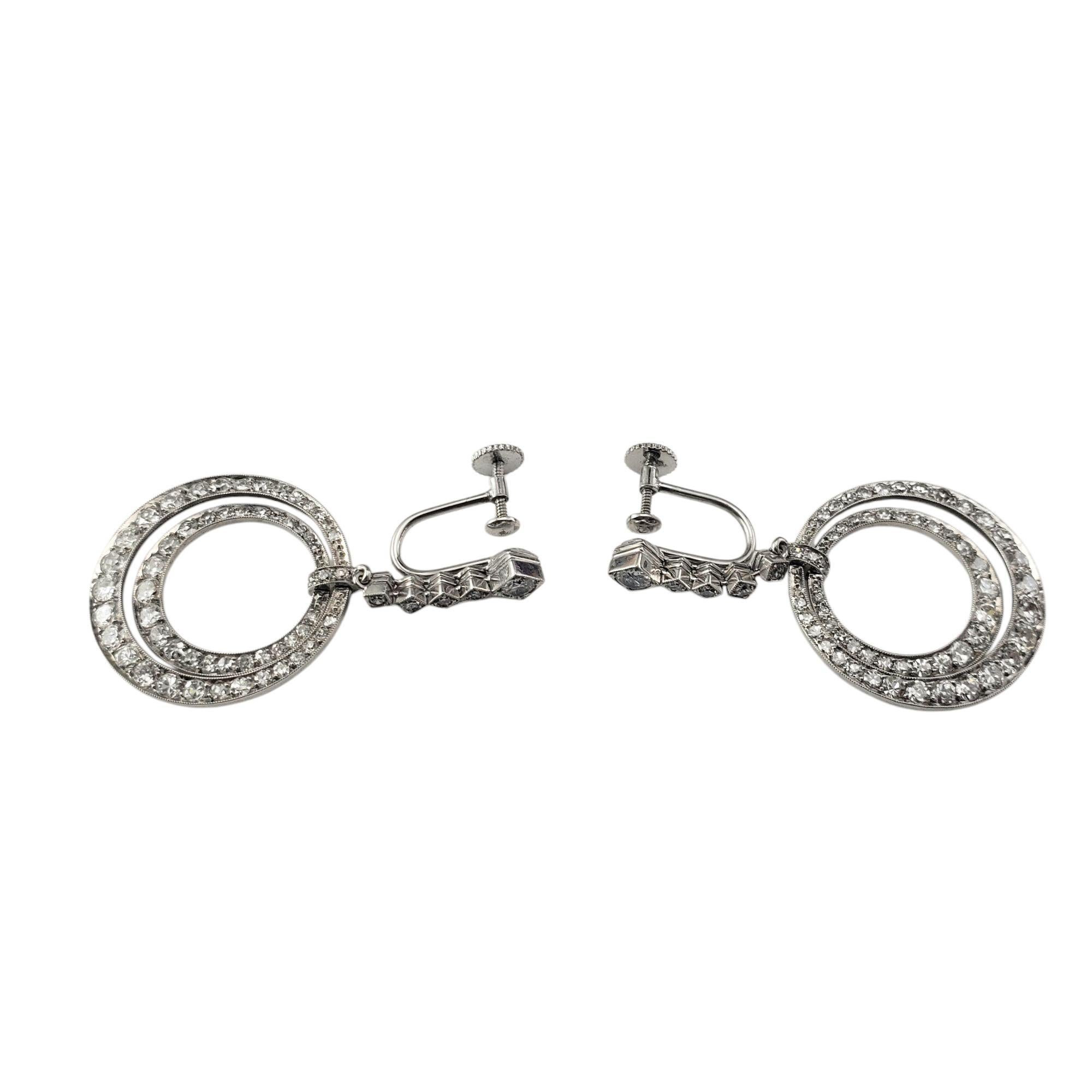 Antique Platinum and Diamond Screw Back Dangle Hoop Earrings-

Add timeless sophistication to your collection with this exquisite pair of antique double hoop earrings. Crafted in luxurious platinum, these earrings are set with shimmering old cut