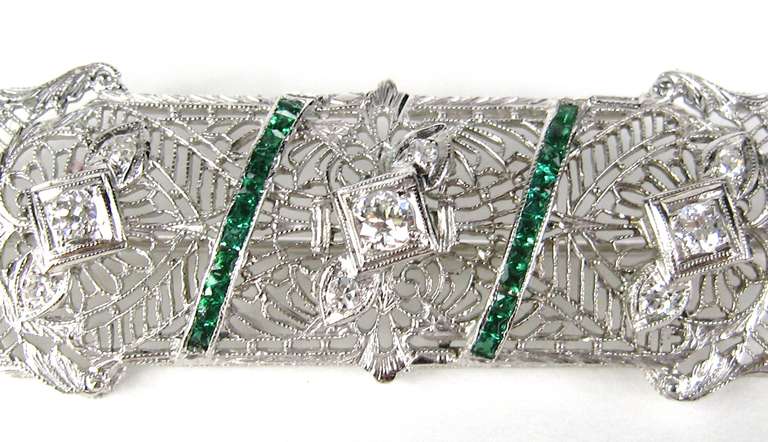 Stunning Platinum Art Deco Filigree Brooch with 9 Diamonds. Totaling .40 Carats. Color F/G Clarity VS/SI1. Matching Ring is also available. This measures 2.23 in x .75 in Be sure to check our store front for more fabulous pieces from this