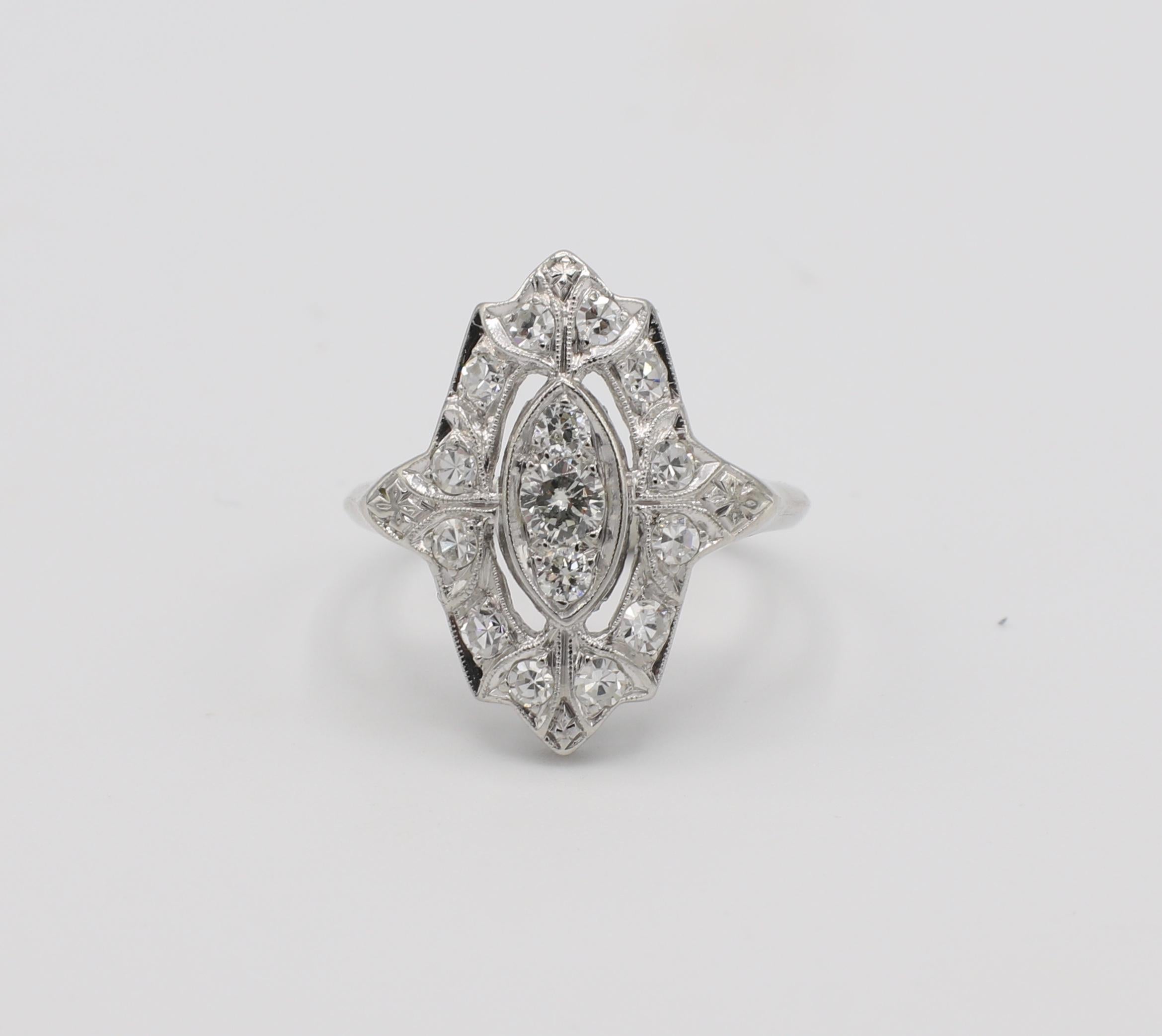 Antique Platinum Diamond Navette Ring 

Metal: Platinum
Weight: 3.25 grams
Diamonds: Old European & Single Cut diamonds, approx. .50 CTW G VS
Size: 4 (US)
Band is 1.3mm wide
Top of ring measures approx. 17.5mm x 15mm 
