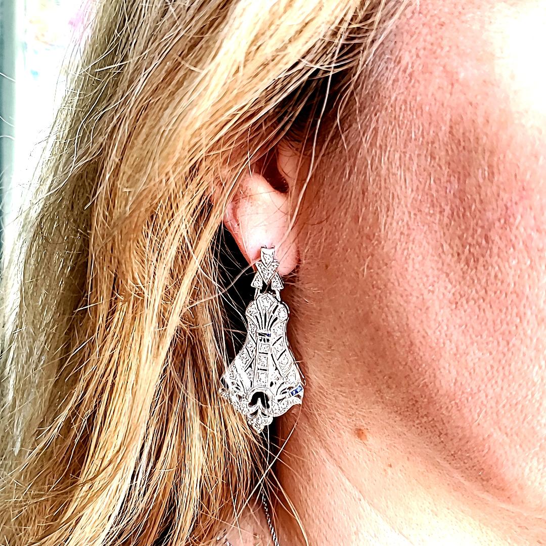 Combining hand engraving, milgrain and filigree detail - these beauties check all of the boxes for one amazing pair of Art Deco earrings. Set in platinum with diamonds and French Cut sapphires, these earrings articulate beautifully in the ear.