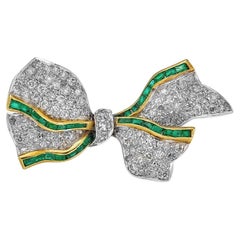 Antique Platinum Bow Brooch with Diamonds and Emeralds
