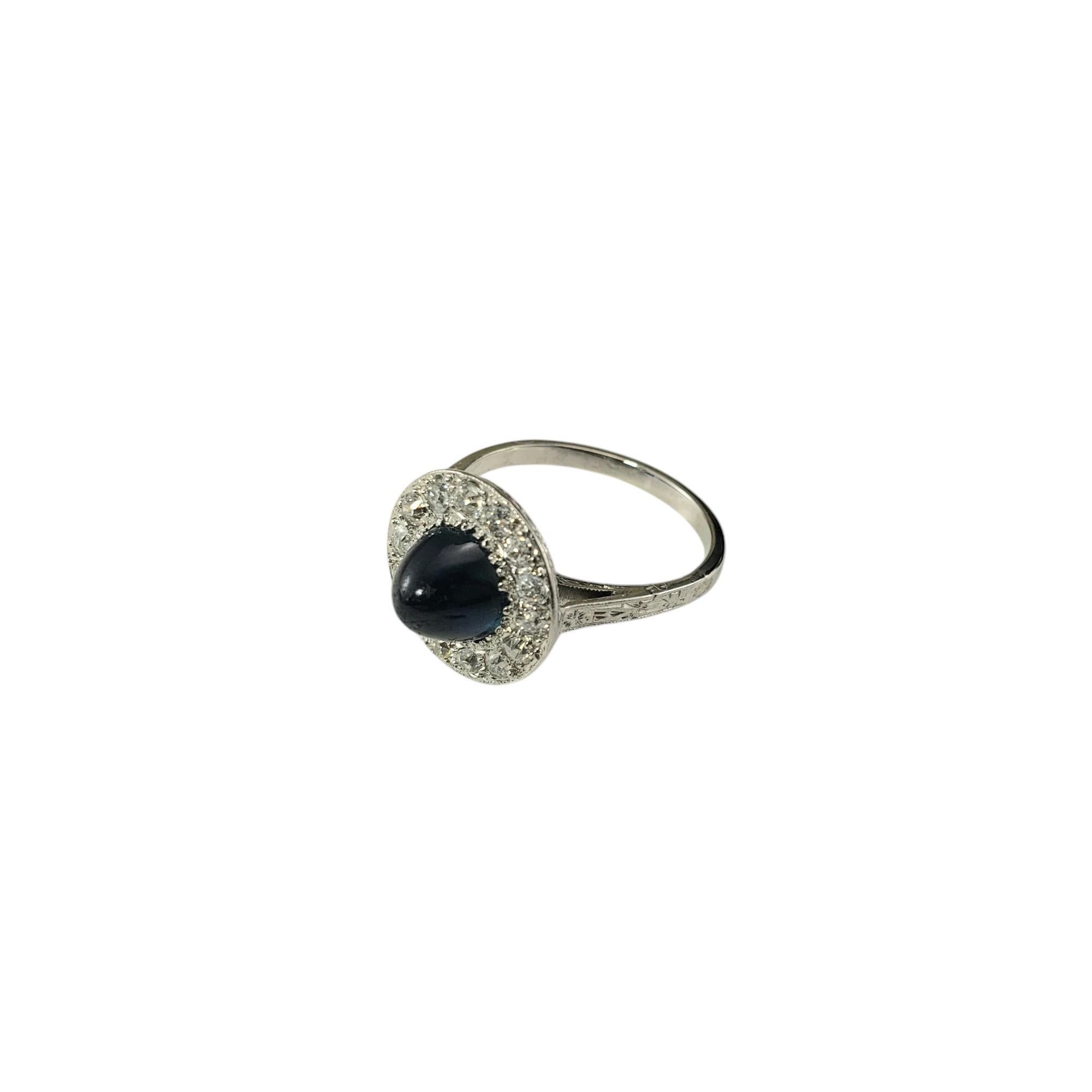 Antique Platinum Cabochon Sapphire and Diamond Ring Size 5-5.25 JAGi Certified-

This stunning ring features one cabochon sapphire (6.9 mm) surrounded by 14 Old European cut diamonds set in classic platinum. 

Width: 12.7 mm. Shank: 1.75
