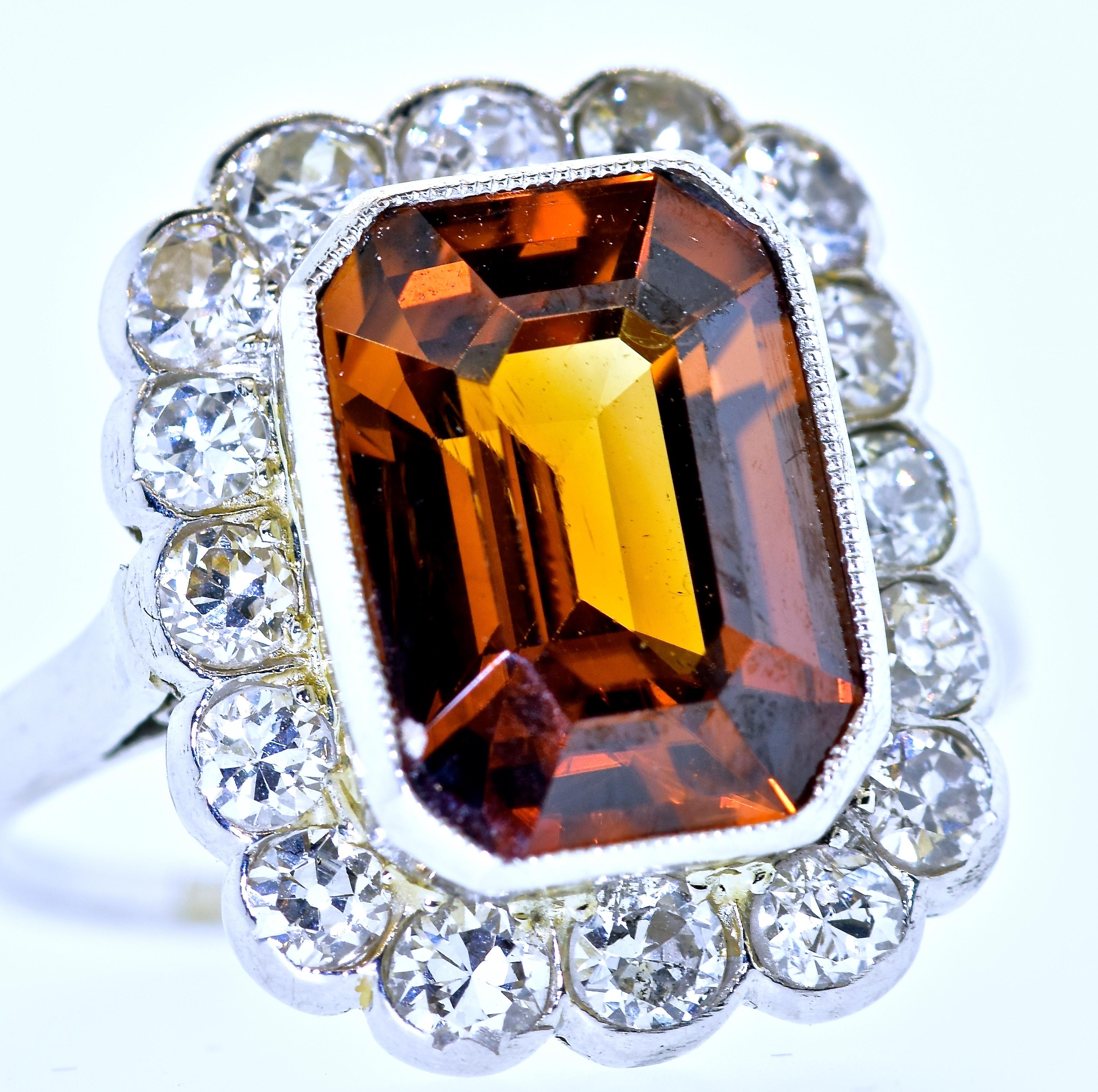  Fine natural cognac Zircon is the center stone of this fine antique Edwardian ring. This color is very unusual in the mineral Zircon.   It's  color has flashes of red which one rarely sees.  This stone weighs approximately 10 cts. and is surrounded