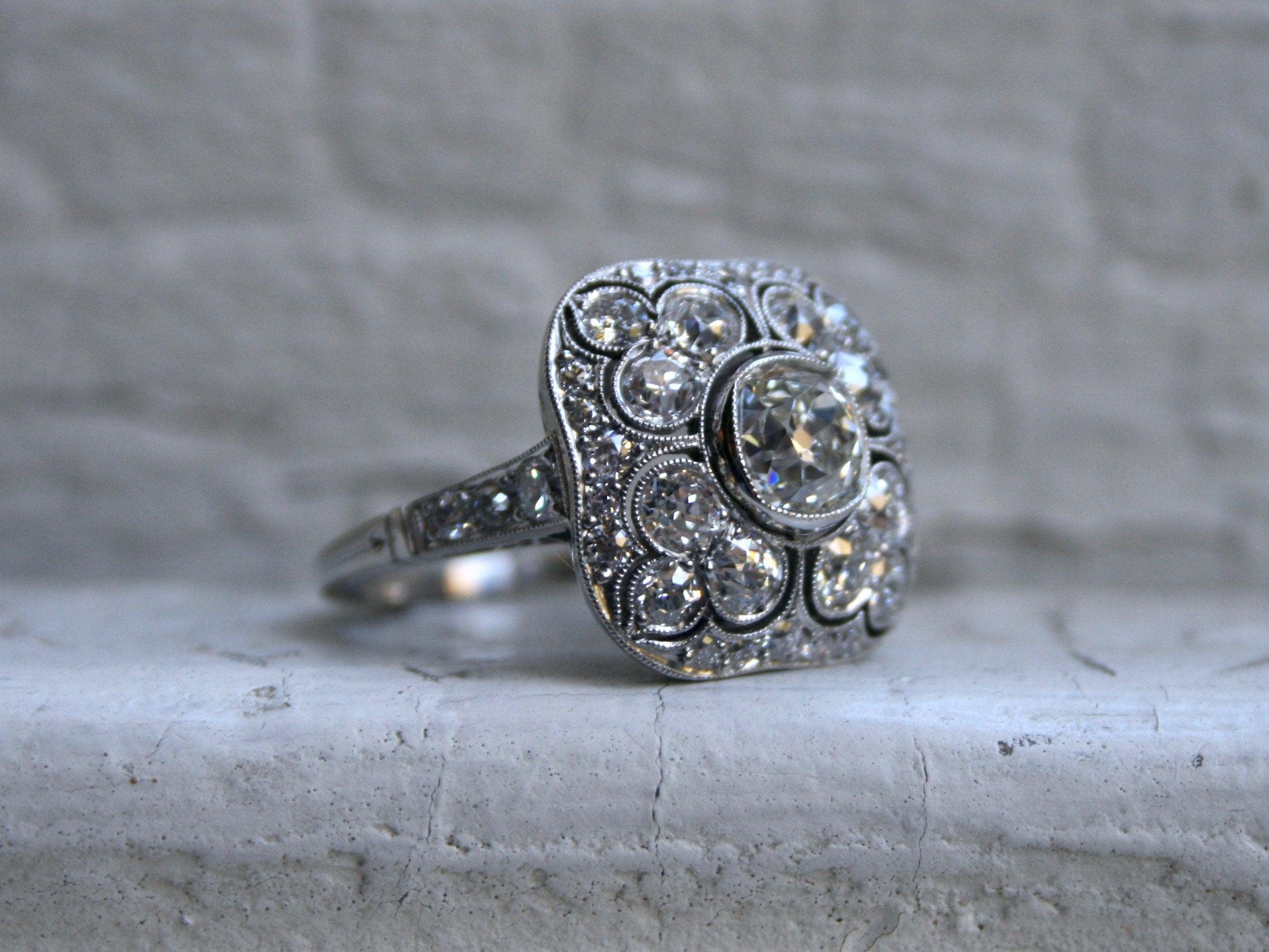 OH. MY. GOODNESS!! This Antique Diamond Cluster Engagement Ring is amazing for many reasons - and it might just my absolutely favorite cluster yet (Yes, it's THAT impressive!). The antique, tiered styling is wonderful, the massive diamond sparkle is