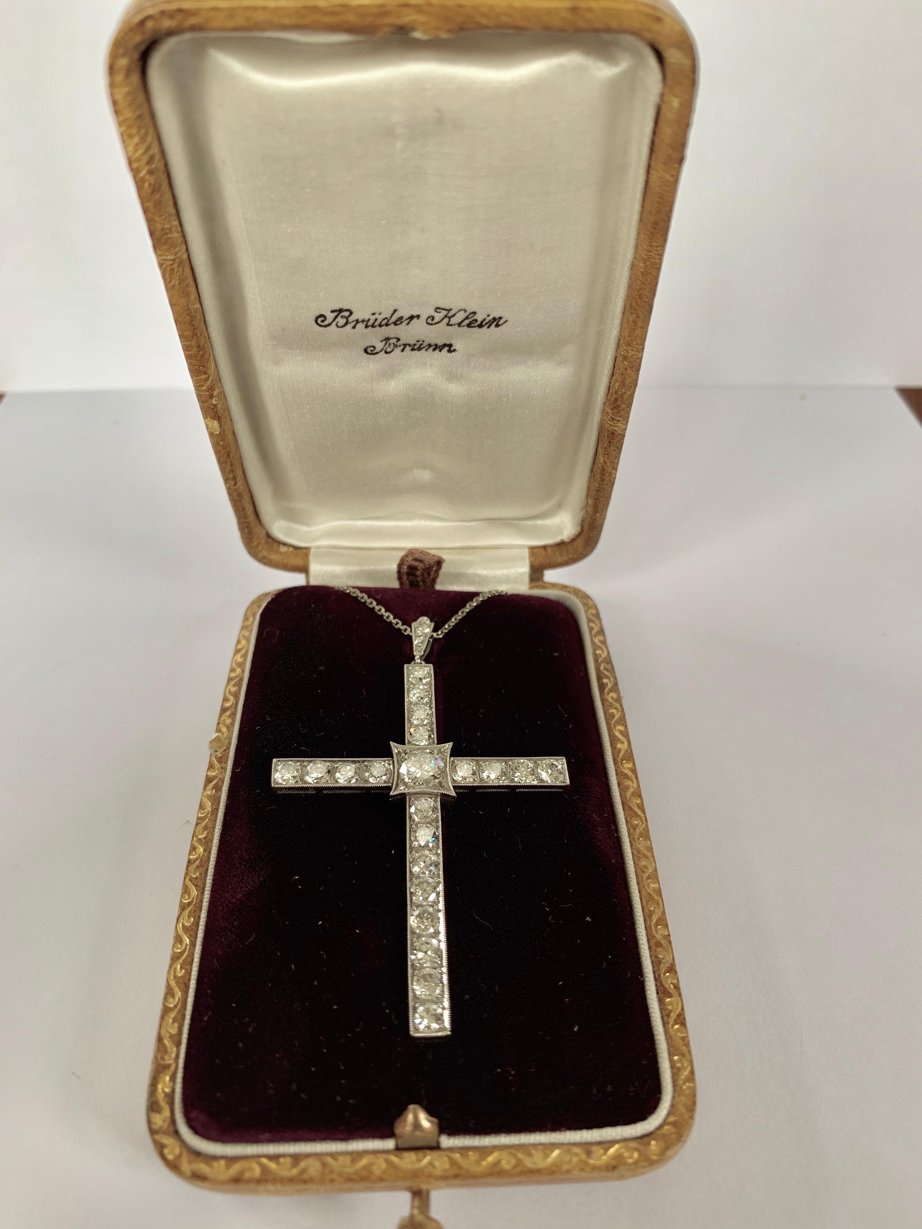 This stunning antique Art Deco diamond cross pendant of immaculate workmanship is crafted in solid platinum. The center is exposing a sparkling European round-faceted diamond weighing approximately 0.50cts, H color, si clarity. The fascinating cross