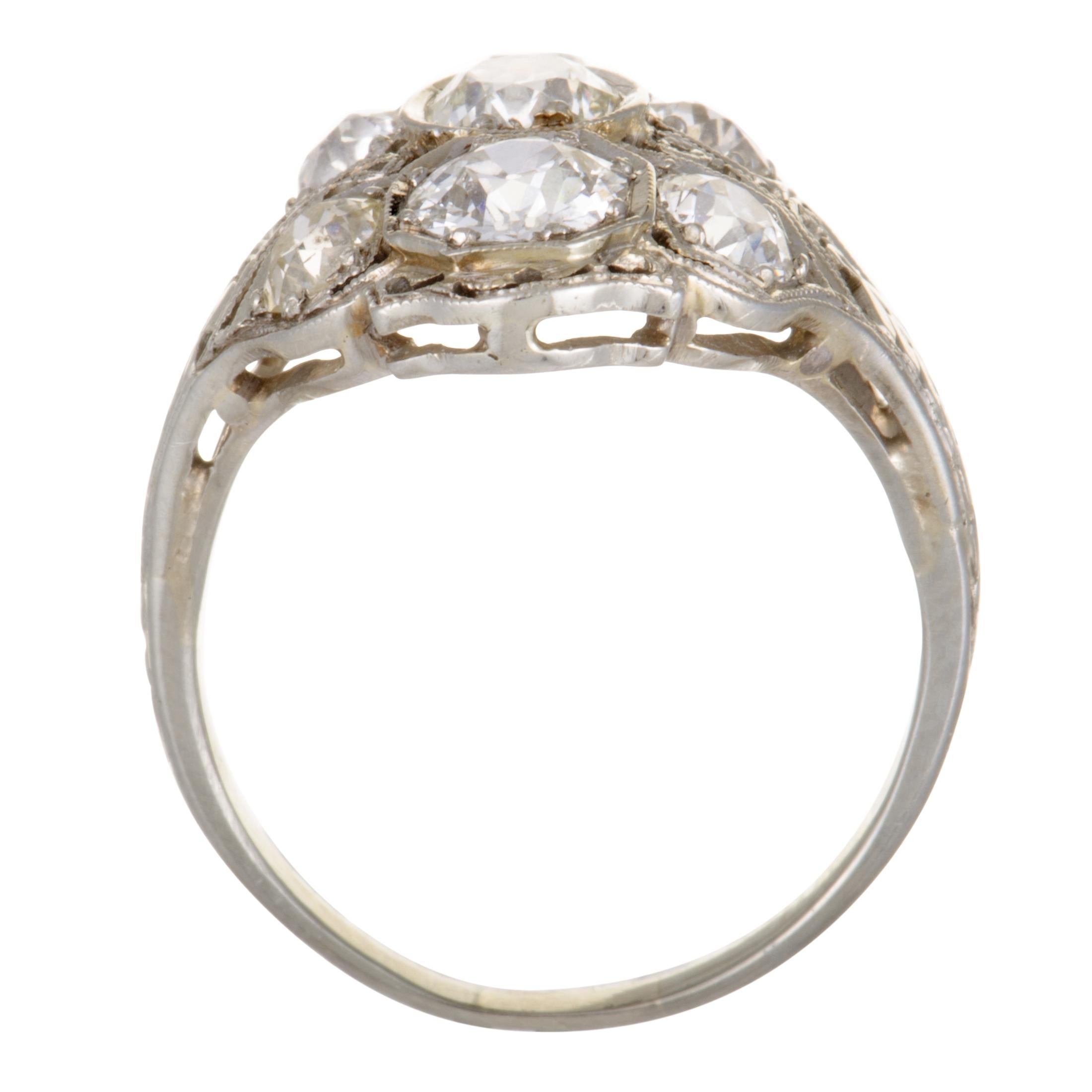 Boasting the ever-enticing filigree design, this exceptional antique ring will add a compelling touch of timeless extravagance to your ensemble. The ring is crafted from platinum and set with expertly cut diamond stones that weigh approximately 2.25