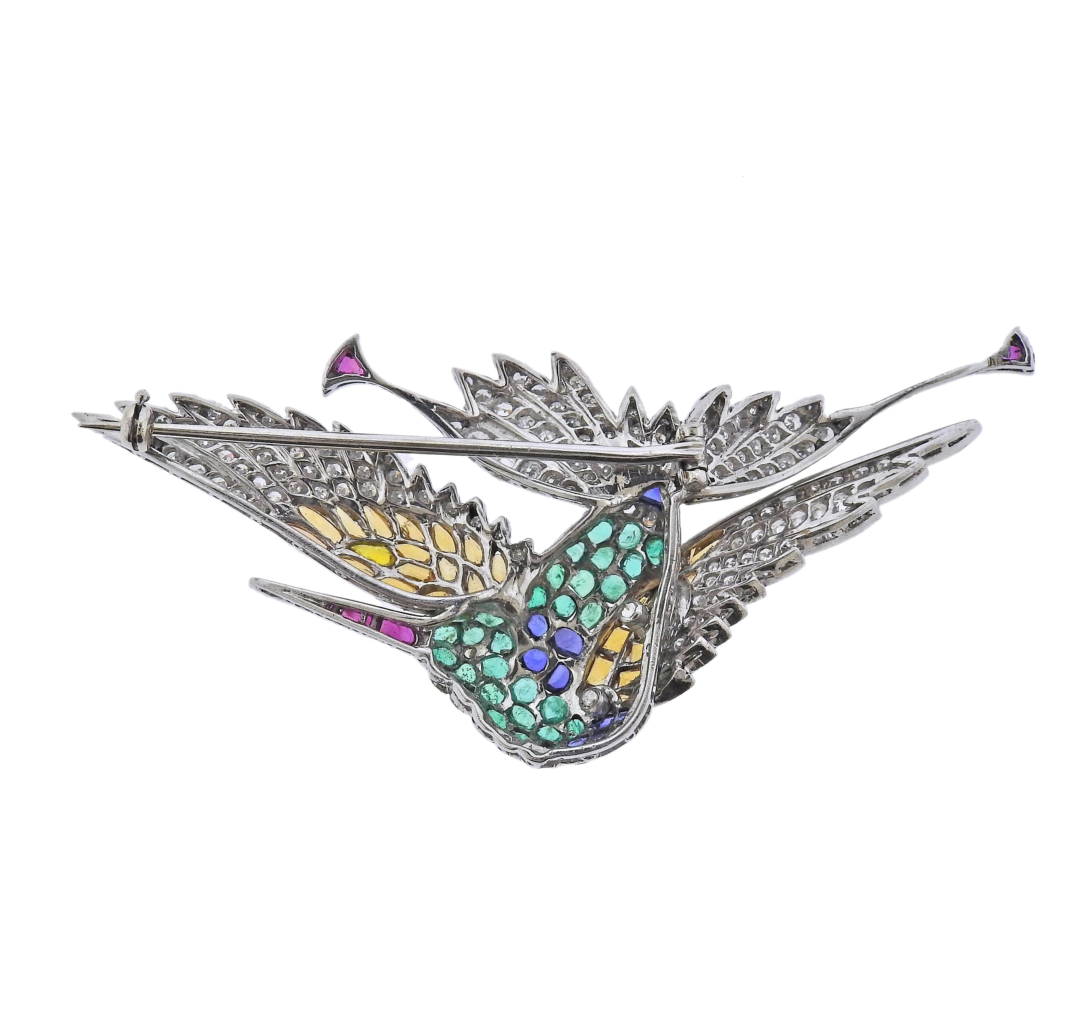 Antique platinum bird brooch, adorned with rubies, emeralds, sapphires, citrines and approx. 0.60ctw in diamonds. Brooch measures 2 5/8