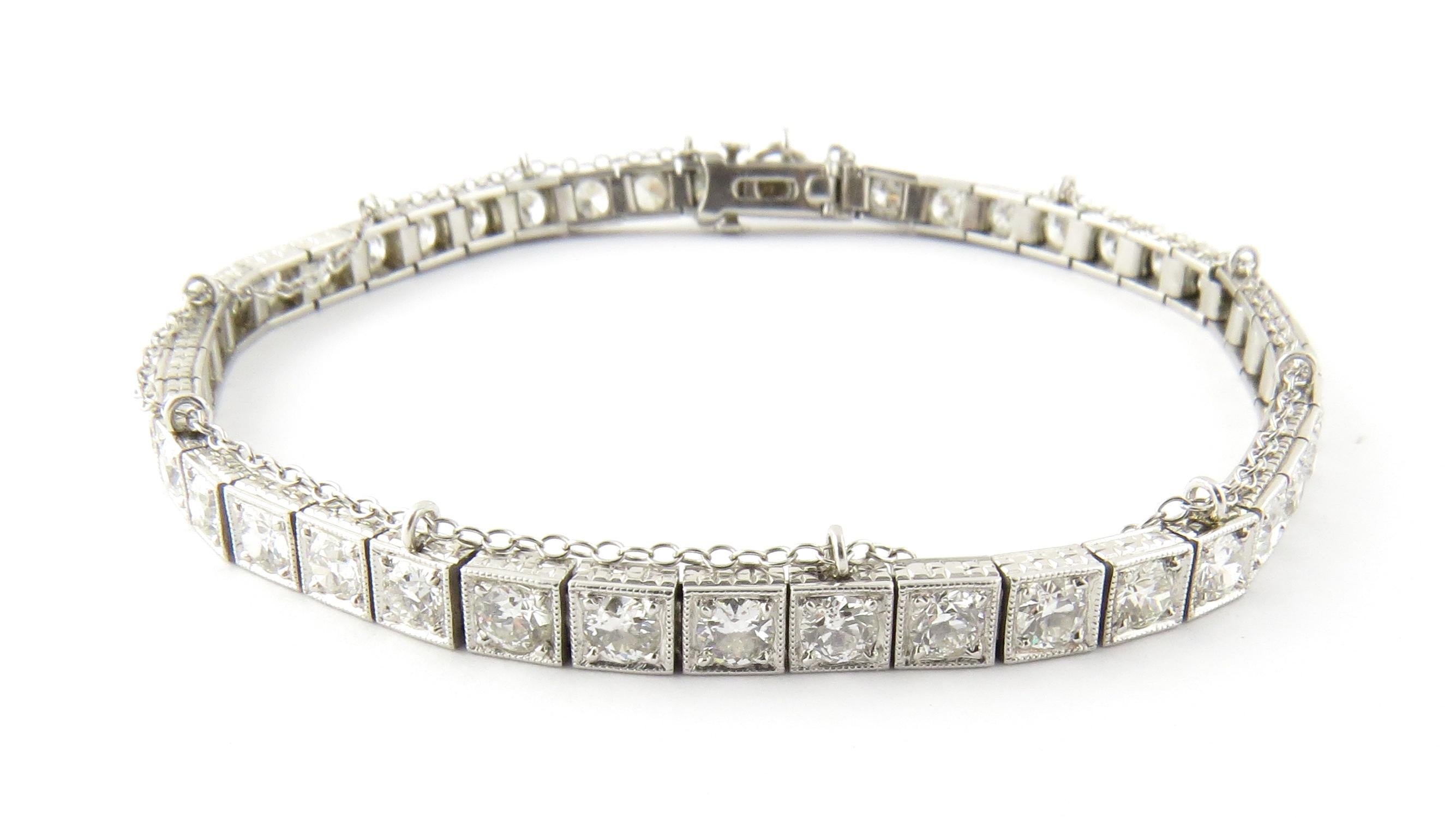 Antique Platinum Diamond Tennis Bracelet 

This gorgeous bracelet is full of sparkle containing 44 diamonds each approx .10 ct each for a total ct weight of 4.4 cts 

Safety chain runs throughout

Chain is 10K White Gold

Bracelet marked PLAT

20.3