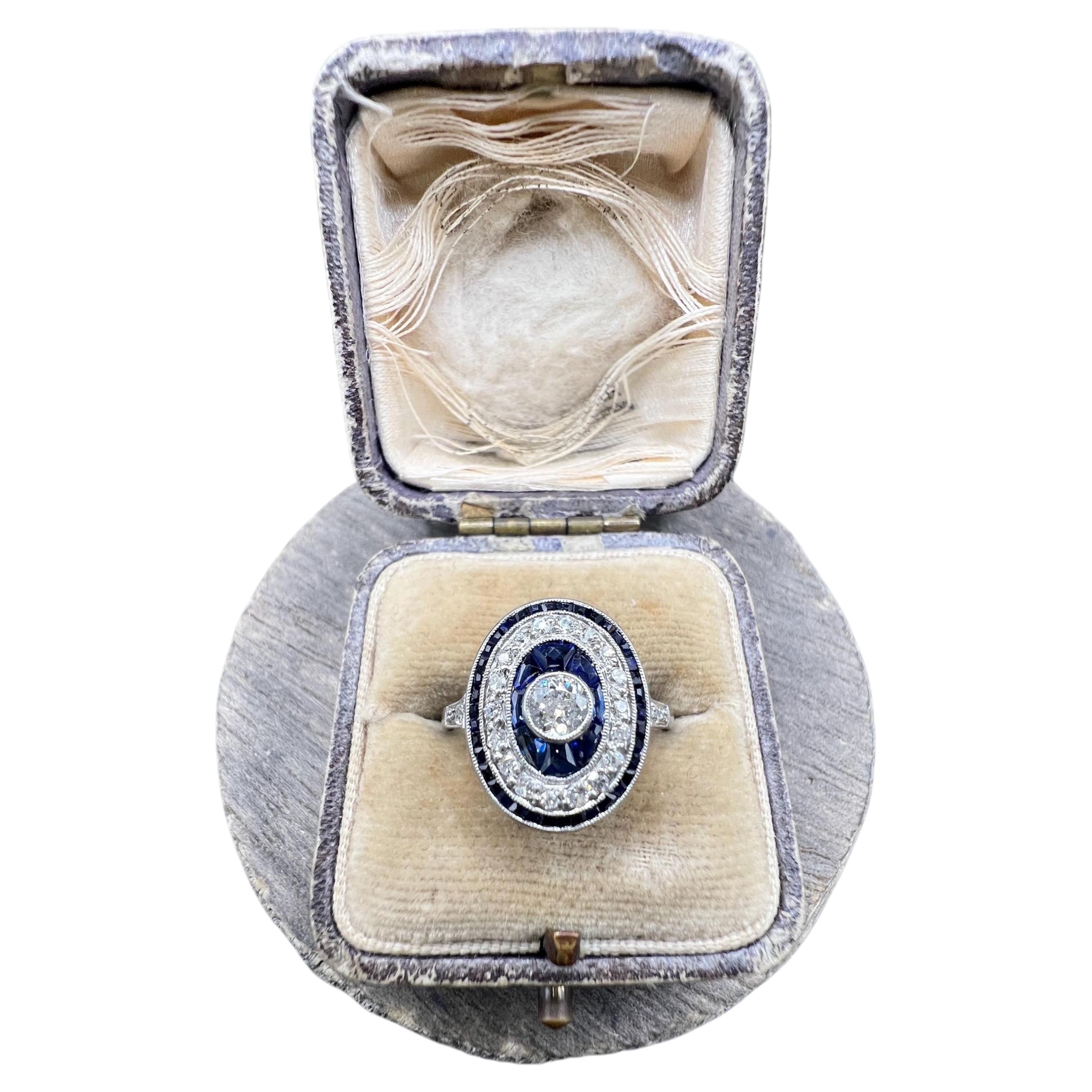 Antique Platinum, Edwardian era Sapphire & Diamond Oval Halo Cluster ring