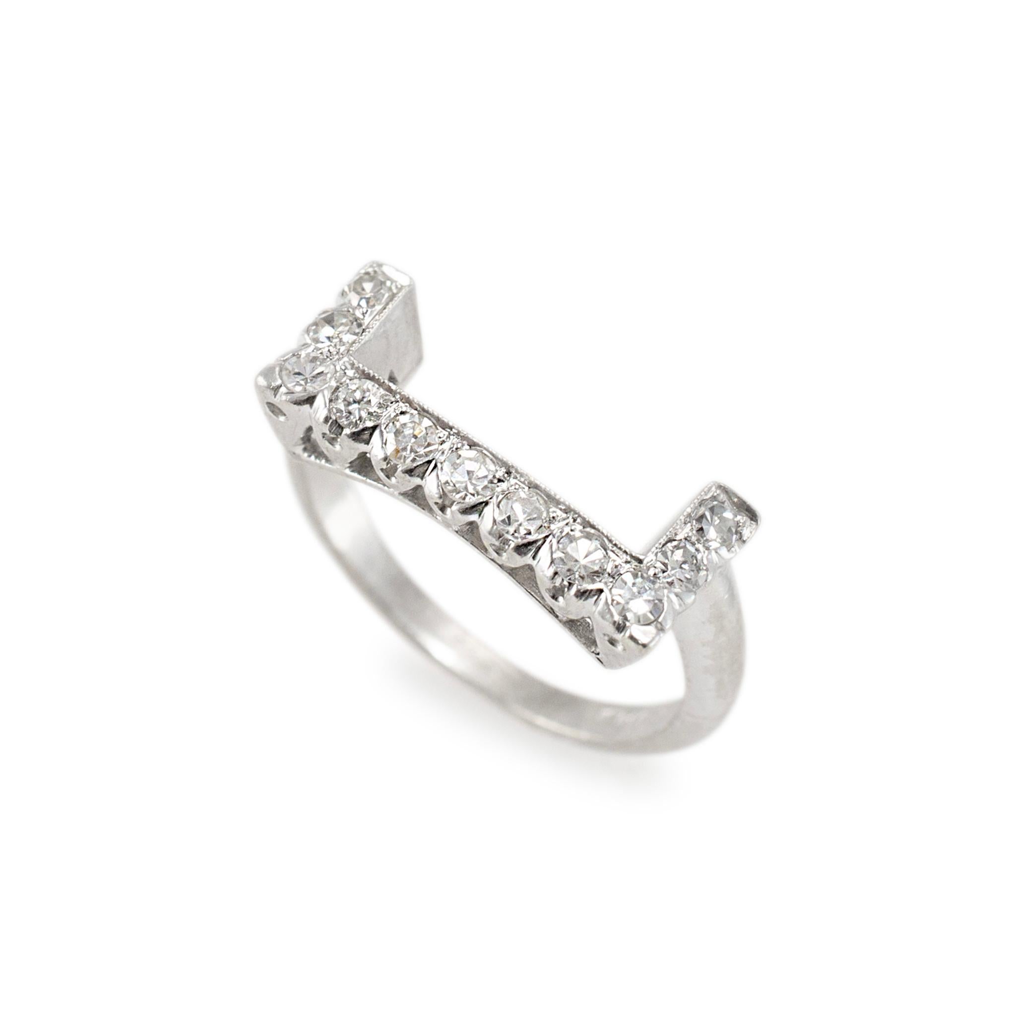 Gender: Ladies

Metal Type: Platinum

Size: 6

Shank Maximum Width: 2.50 mm

Head Width: 7.10 mm

Weight: 5.44 Grams

One ladies handmade filigreed platinum, diamond antique wedding band with a half-round shank. The metal was tested and determined