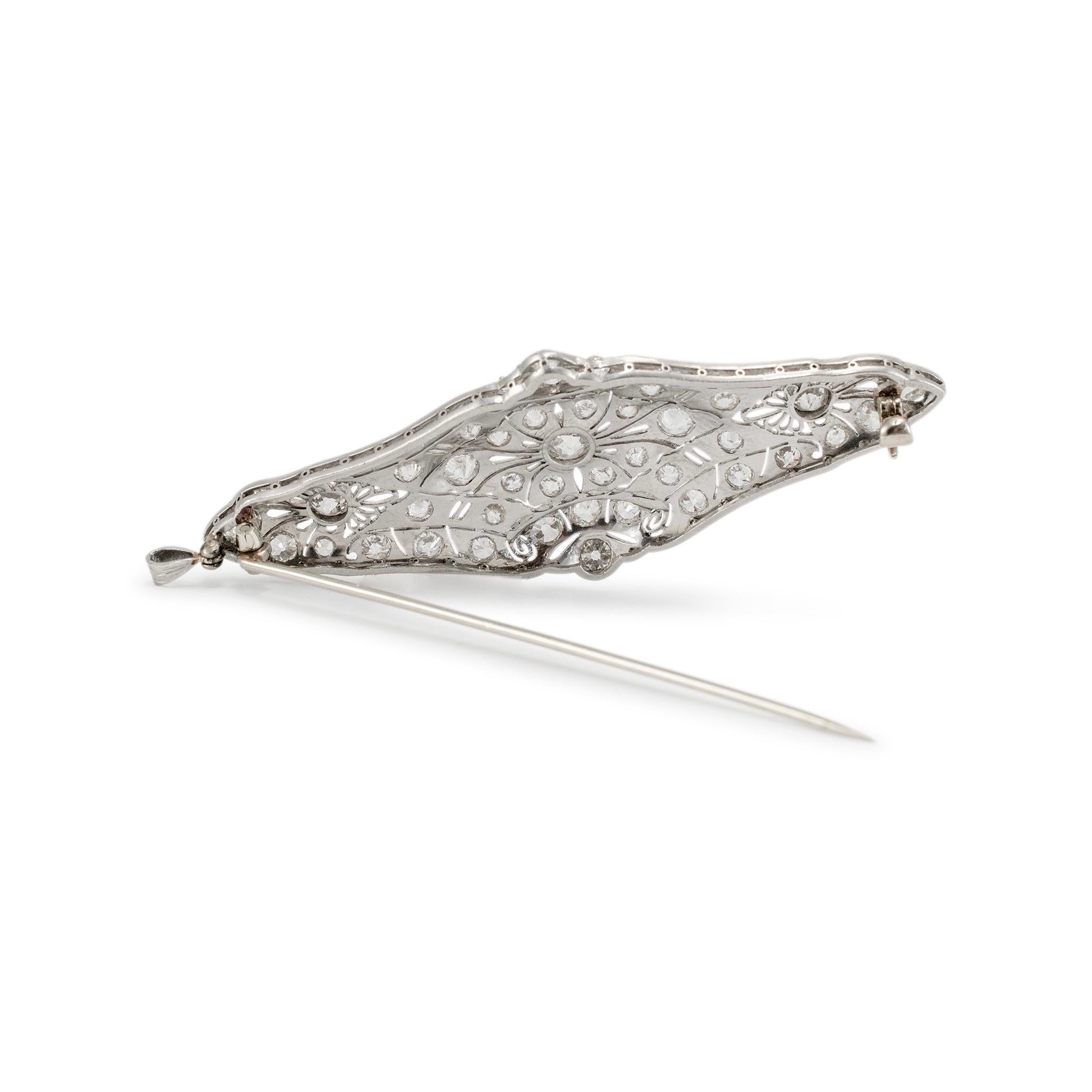 Gender: Ladies

Metal Type: Platinum

Length: 2.75 inches

Width: 1.00 mm

Weight: 13.09 Grams

One lady's handmade platinum diamond antique brooch / pendant. The metal was tested and determined to be platinum.

Antique in excellent condition. Signs