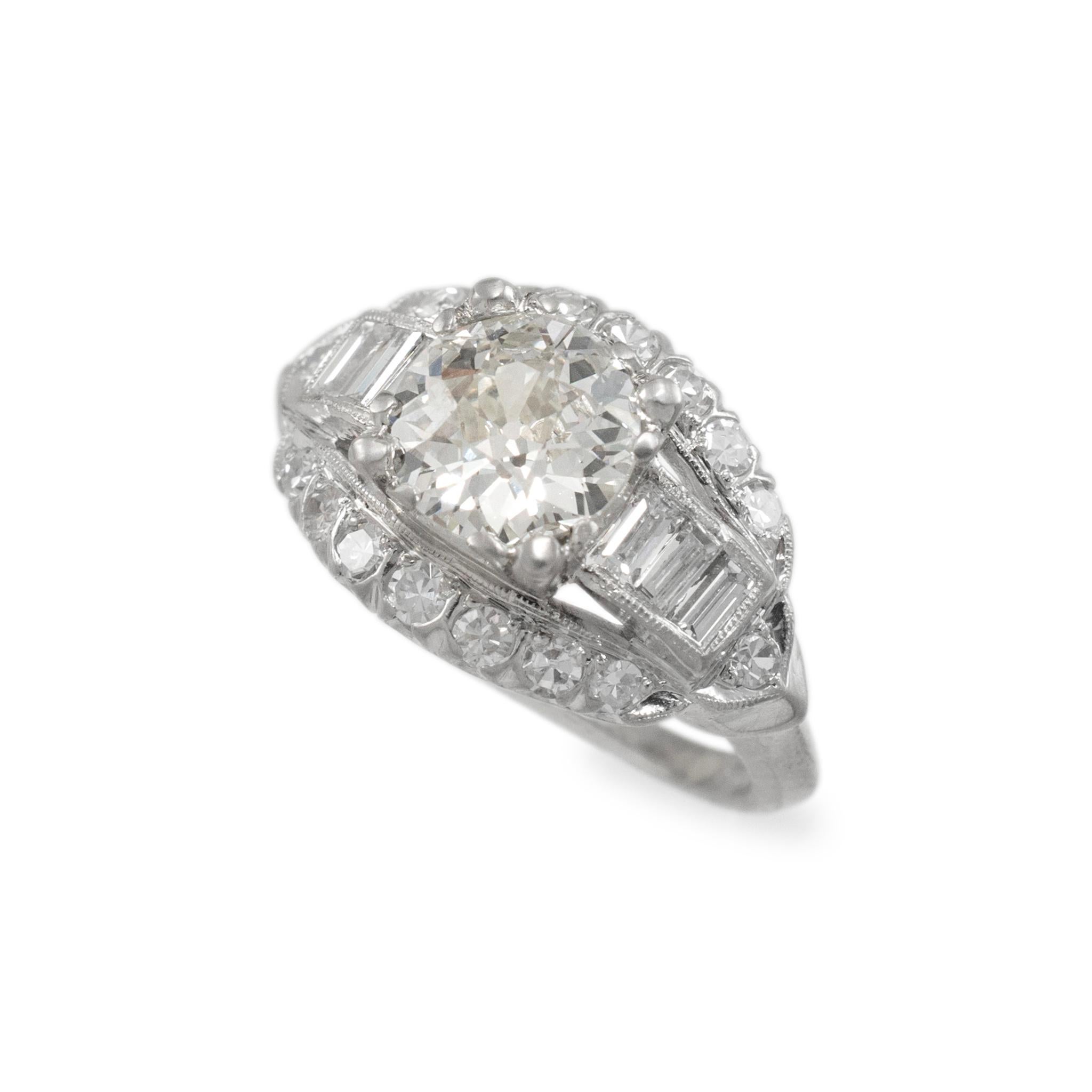 Gender: Ladies

Metal Type: Platinum

Ring Size: 6

Weight: 8.43 grams

Platinum diamond antique engagement accented ring with a knife-edge shank. The metal was tested and determined to be platinum. Engraved with 