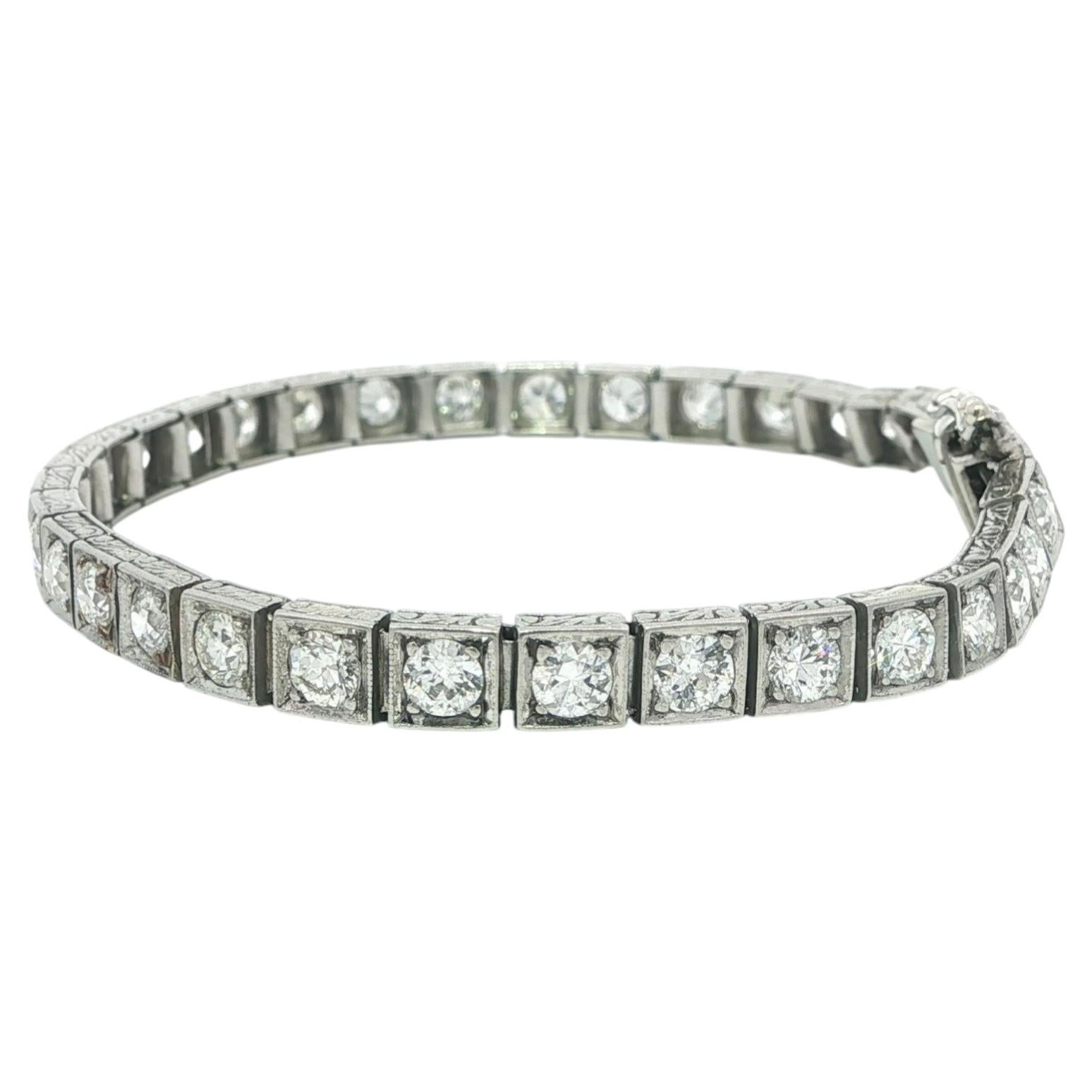 Bracciale tennis antico in platino e oro con diamanti taglio antico da 7 ct. con linea incisa