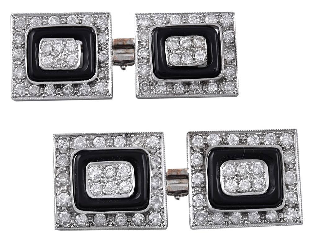 The ultimate in dress cufflinks.  Large double-sided rectangles made of platinum and 18K gold.  Encrusted with diamonds, accented by a rectangular onyx inset.  3/4