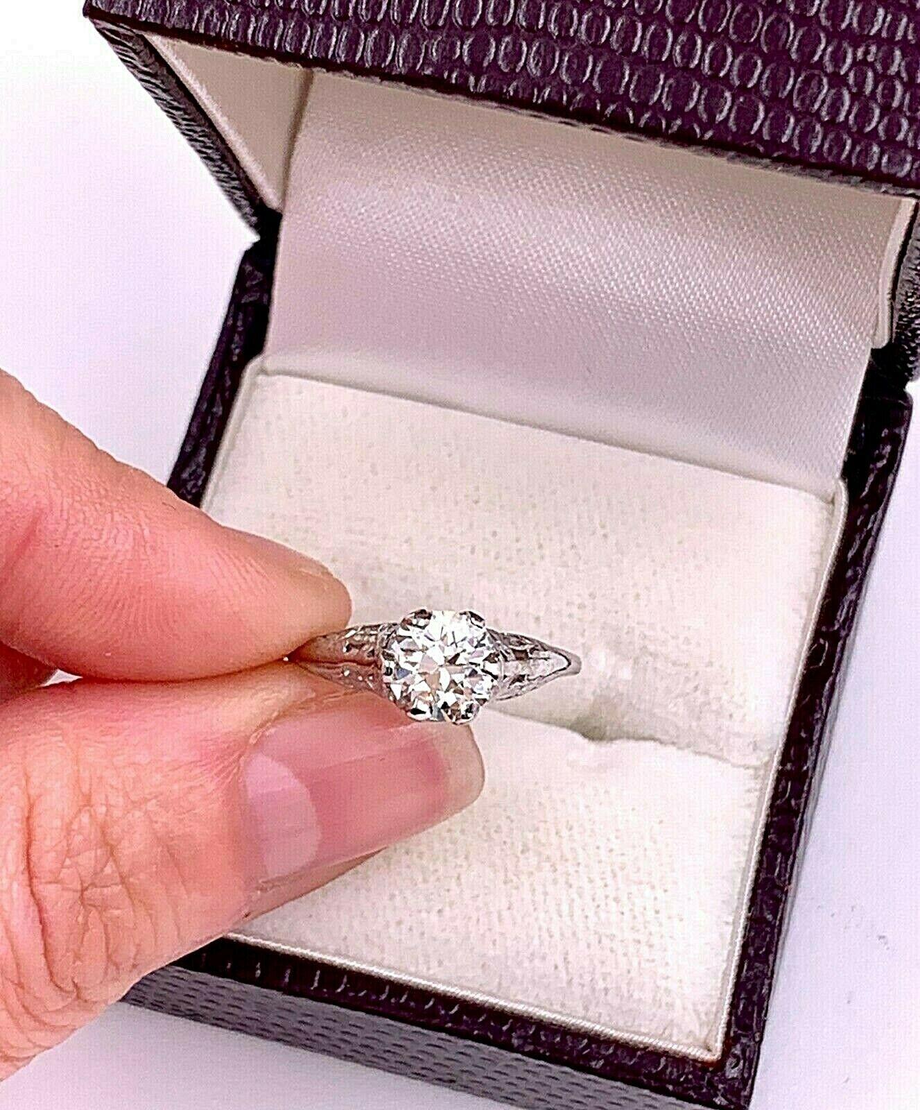 Antique Old Cut Diamond Solitaire Engagement Ring 

Style:  Edwardian
Metal:  Platinum
Size:  4.75 - sizable
Carat Weight:  1.01 Carats
Diamond Shape:  Round Old European Cut
Diamond Color & Clarity:  J - K Color,  VS2 Clarity
Includes:  Ring Box,