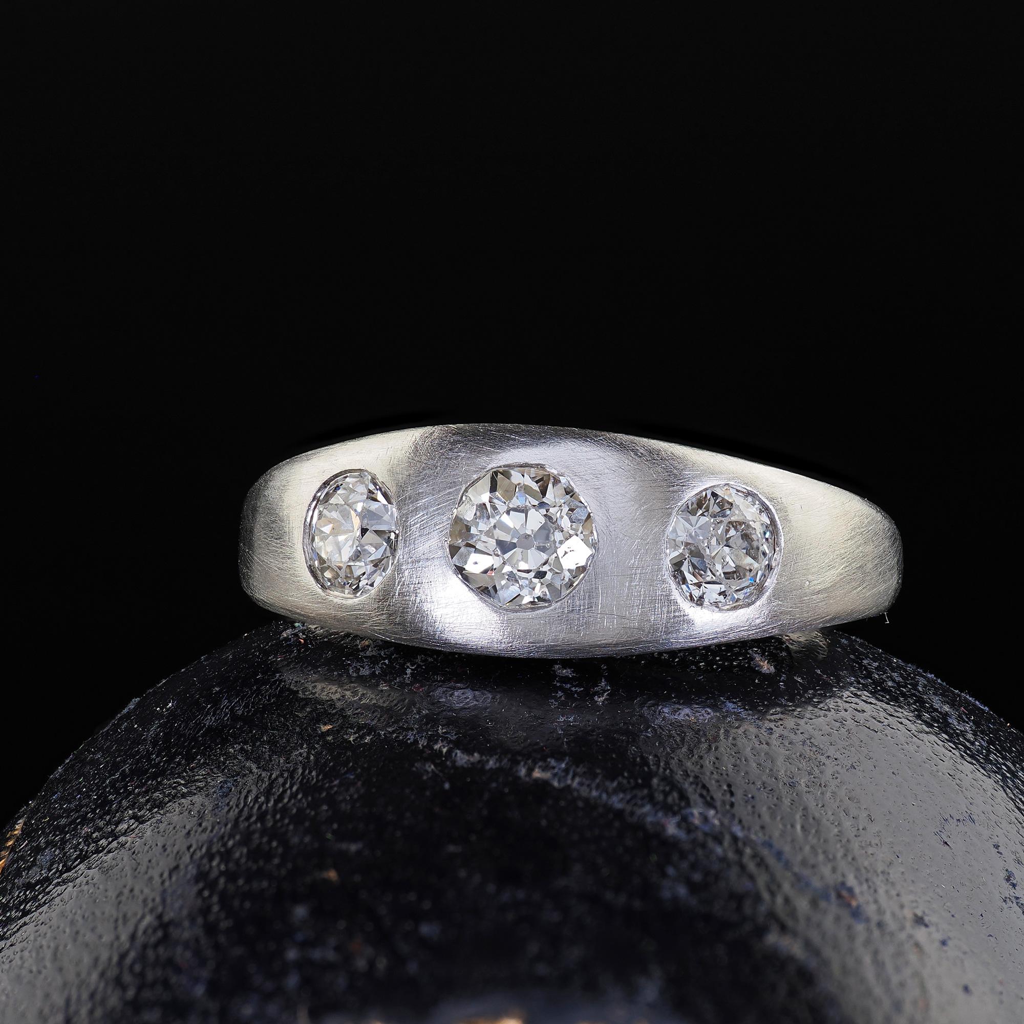 Beautiful Antique Platinum Old European Cut Diamond Three Stone Flush Set Ring. This beautiful Art Deco old European cut three stone ring is crafted in platinum. The ring features three chunky old European cut diamonds that are flush set in solid