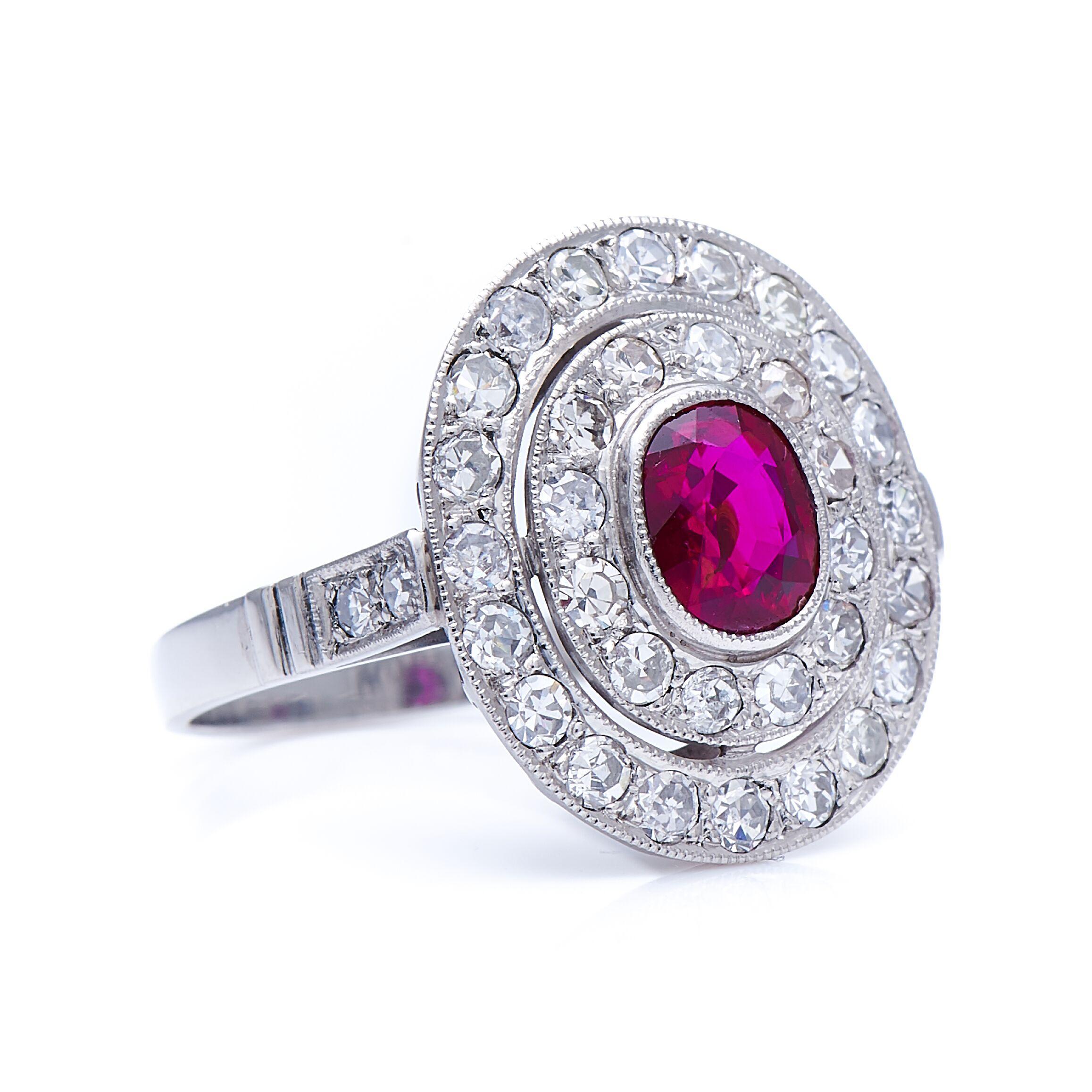 Ruby and diamond ring. The unheated Burmese ruby at the centre of this ring is of exceptional quality, weighing just over one carat, with a richly saturated, deep red tone, excellent clarity and a well-proportioned cut. Surrounding this rare stone
