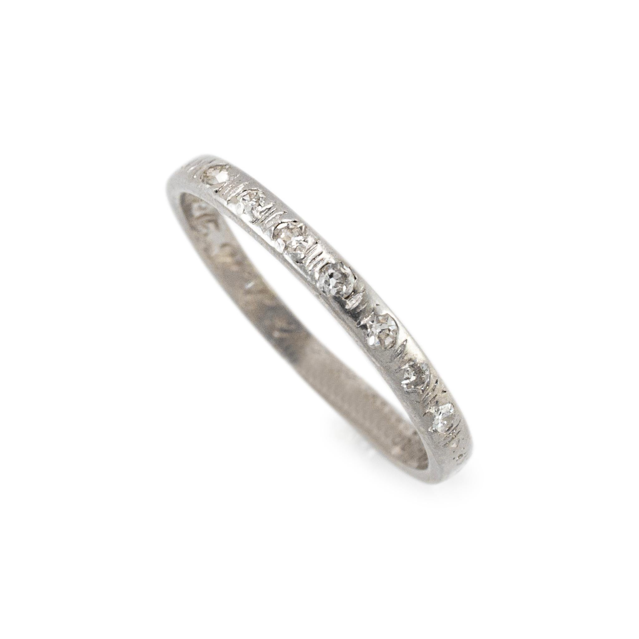 Gender: Ladies

Metal Type: Platinum 

Ring Size: 7

Width: 2.25 mm

Weight: 2.43 grams

One ladies hand-engraved platinum seven-across diamond antique wedding band with a half-round shank. The metal was tested and determined to be platinum.