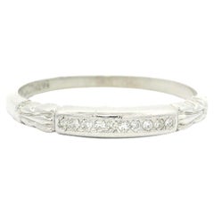 Bague de style boucle en platine antique avec diamant en serti clos à taille unique