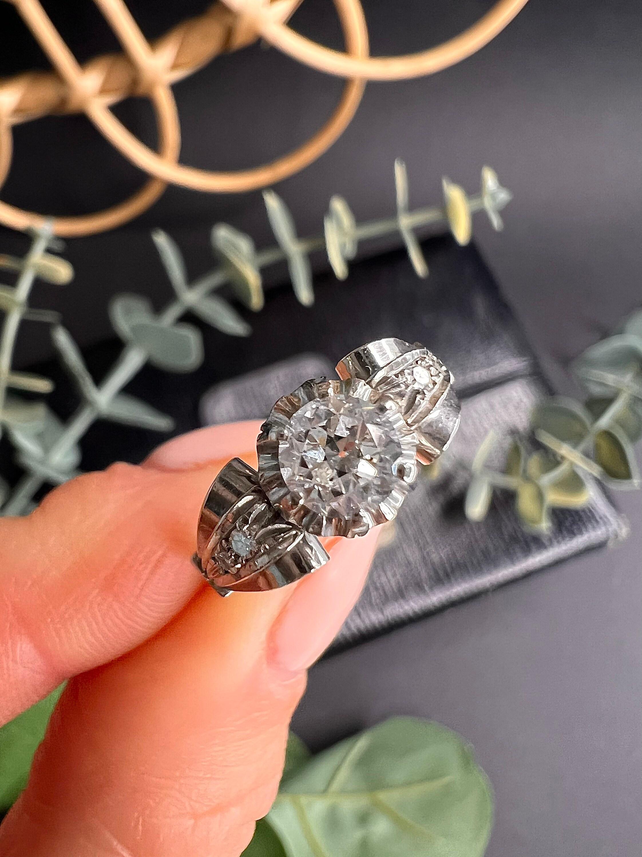 Antique Diamond Ring

Platinum 

Circa 1920’s 

Fabulous Single Stone Diamond Ring. Set with a Centre Old European Cut Diamond.
Estimated 0.60cts, HI Colour & VS2 Clarity. 
The Ring Boasts, Beautiful Scrolled Shoulders Set with Two Small Diamonds
