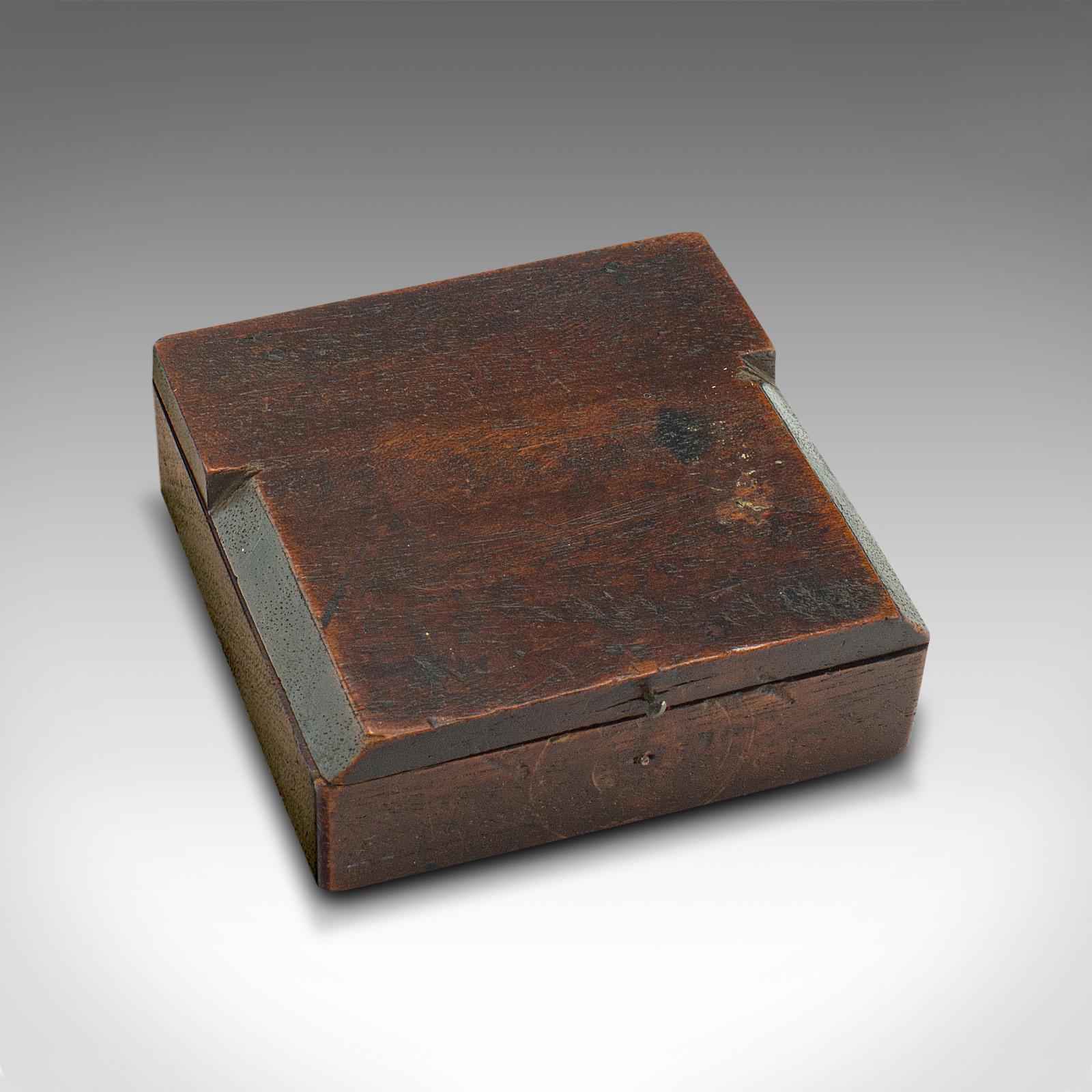 This is an antique pocket explorer's compass. An English, mahogany cased instrument, dating to the Victorian period, circa 1880.

Wonderful pocket compass with charming details
Displays a desirable aged patina throughout
Select stocks shows fine