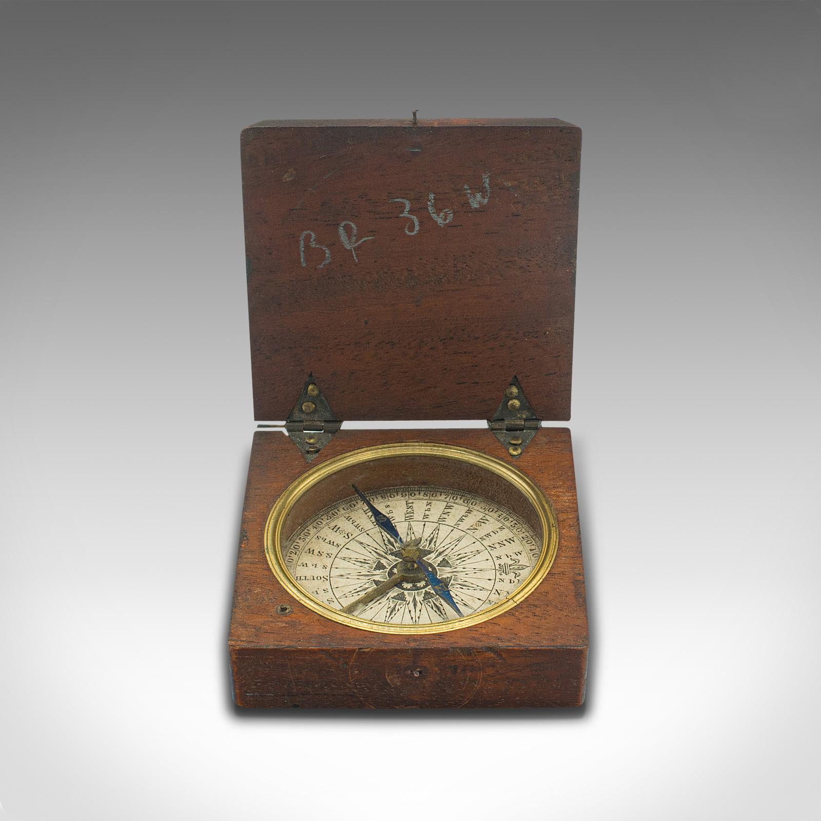 antique compass in wooden box